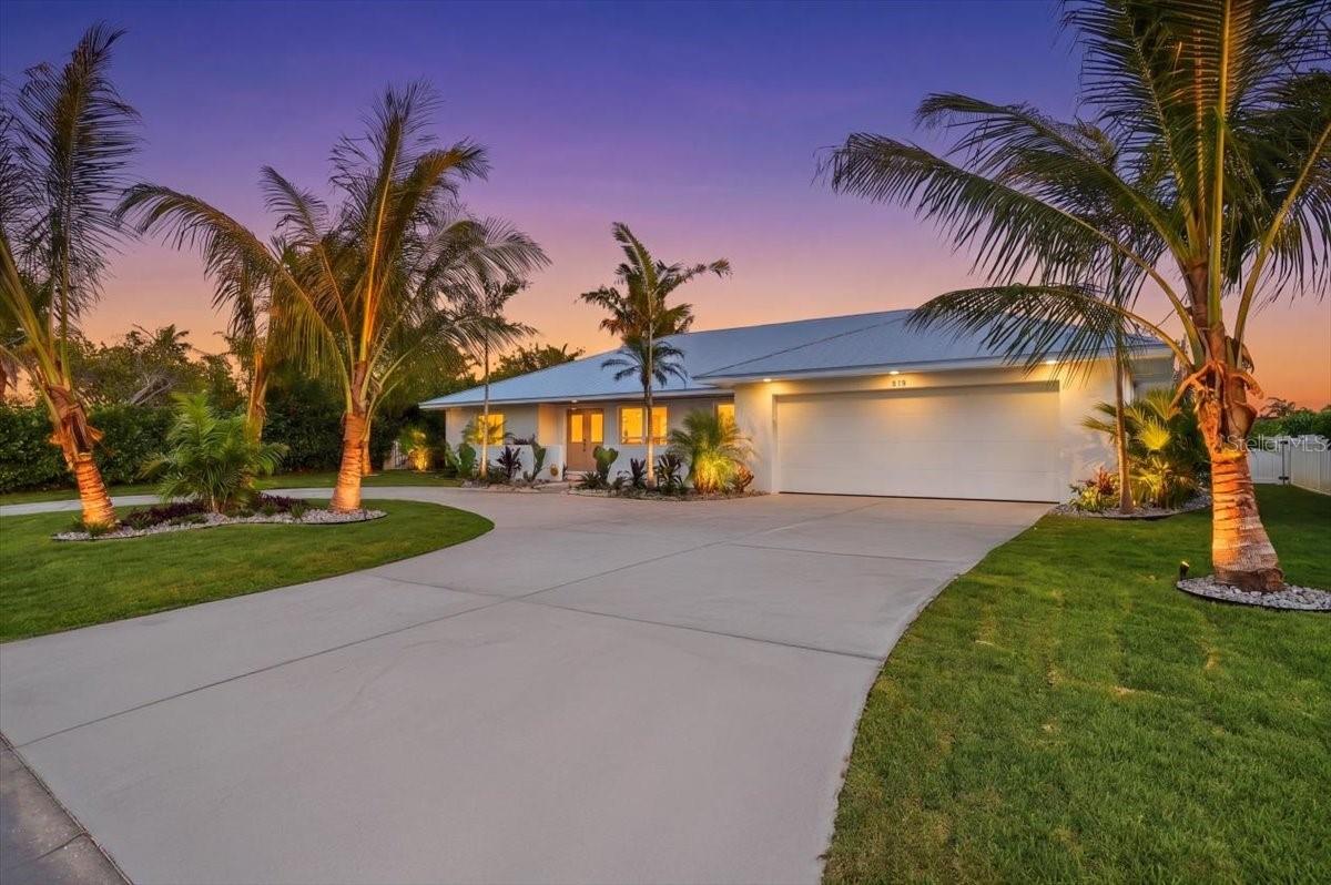 Experience the pinnacle of Anna Maira Island living in this stunning waterfront estate, situated in the highly sought-after boating and golf community of Key Royale. Freshly completed in 2026, this residence has undergone a meticulous, "to-the-studs" transformation. Offering the ultimate peace of mind, the property sits at a noticeably higher elevation than most homes on the island, features a brand-new metal roof, and is fully equipped with premium PGT windows and full hurricane impact-rated protection throughout. Offered furnished with designer-curated pieces, the expansive, light-filled open floor plan flows effortlessly across premium large-format tile flooring. At the heart of the home is a fully equipped kitchen, anchored by a massive island, custom cabinetry, a beautiful coastal-blue tile backsplash, and top-tier GE Café stainless steel appliances. An adjacent butler’s pantry, complete with an additional sink, ample storage, microwave, and a dedicated wine refrigerator, ensures effortless hosting. Accommodations include a highly flexible fourth bedroom, perfectly suited for a private home office, media room, or custom bunk room to maximize guest comfort. The interior spaces seamlessly transition to a spectacular backyard paradise through massive impact sliding glass doors. Positioned on one of the largest canals on Key Royale, this property is a boater’s dream, with an expansive private dock with direct, deep-water access. Designed for sunset entertaining, the expansive outdoor living space centers around a newly resurfaced PebbleTec pool, framed by elegant shellstone pavers and a large covered patio. The perfectly manicured grounds are framed by mature palm trees, professional exterior lighting, and a full irrigation system. Located just moments away from the exclusive Key Royale Club, offering the island’s premier private golf and social amenities, this fully updated masterpiece delivers coastal luxury.