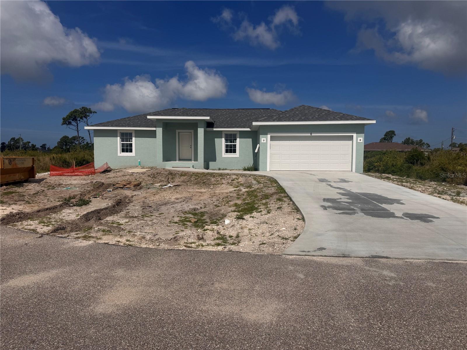 Under Construction. NO FLOOD ZONE !!!! Our SGC3 Model features an open floor plan from the minute you walk in the door. This home as 1639 sq foot of Living Space, 3 bedrooms, 2 baths and 2 Car Garage. The open kitchen is perfect for entertaining, includes a spacious island, breakfast/dining area, and Doors leading to the lanai to enjoy your morning coffee. The master bedroom includes a walk-in closet, Tiled shower, and Dual sink vanity. The 2 Guest bedrooms are located on opposite side of Master making it a split floor plan. Guest bathroom has a tiled shower/tub combo. The living room features cathedral ceilings. The home features plank tile throughout, granite countertops in the kitchen and bathrooms, recessed lighting, ceiling fans in every room, and Stainless Steel Appliances. The home comes with hurricane/storm shutters. COME VIEW THIS BEAUTIFUL HOME or CALL TODAY FOR AN UPDATED LIST OF OUR BUILDS! PLEASE NOTE - the pictures for this listing are a representation of the subject home being constructed. Interior and exterior paint colors, tile color, shingle colors, tray ceilings, fans, lights, manufacturer of appliances, interior/exterior door style, cabinets and landscaping are subject to change. Tax Information is for vacant land