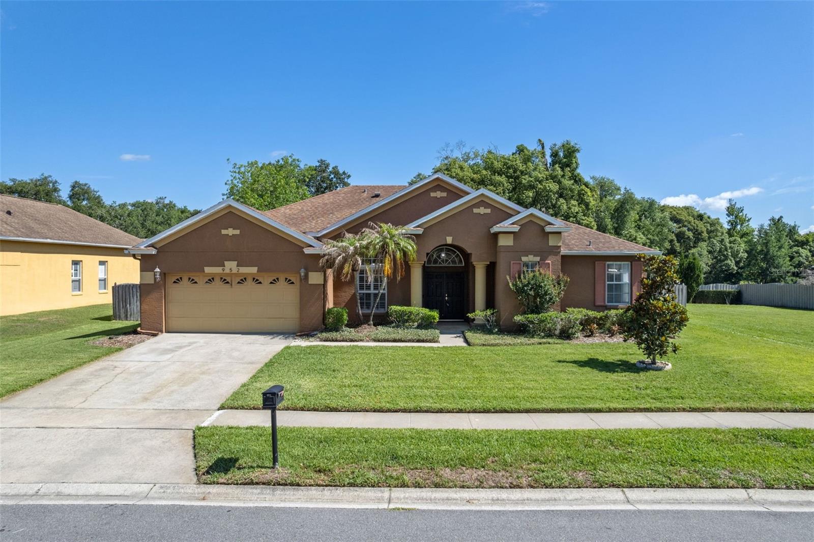 Welcome home to this beautifully maintained 4-bedroom, 3-bathroom pool home located in the highly desirable gated community of
Longwood Club! Perfectly positioned on a quiet cul-de-sac next to a vacant HOA-owned lot, this property offers added privacy and a
peaceful setting. From the moment you enter through the stunning large double doors, you are greeted by views of the solar-heated
saltwater pool through the expansive living room windows, truly capturing Florida living. Laminate and tile flooring run throughout
the home with no carpet in sight. The spacious kitchen features appliances updated in 2020, 42-inch wood cabinetry, a breakfast bar,
center island, and abundant counter space, all opening to the family room with a built-in entertainment center. Triple stacking
sliding glass doors lead to the spacious covered patio and pool area, creating the perfect indoor-outdoor entertaining space. The
primary suite offers a relaxing sitting area along with an updated en suite bath featuring dual vanities, a garden tub, walk-in shower,
and two large walk-in closets. Two additional bedrooms are tucked away down their own private hallway. A separate en suite with a
bedroom and bathroom is off the living area with both space and privacy for guests, multigenerational living, or even potential
rental opportunities, complete with its own access door to the patio and pool. Additional highlights include surround sound speakers
throughout the home and patio ready to be wired and re-activated, a newly rebuilt pool pump, freshly installed garage door springs,
AC less than 2 years old, water heater replaced in November 2020, and a storage shed, ideal for storing pool and lawn equipment.
Conveniently located with easy access to I-4, nearby hospitals, shopping, dining, and just minutes from Reiter Park, this home has
comfort, functionality, and an unbeatable location wrapped in one exceptional package.