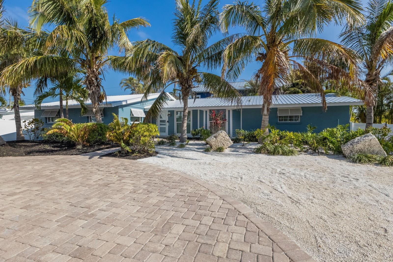 INCREDIBLE VALUE! 5 BEDROOM HOME ON ANNA MARIA ISLAND WITH PROVEN RENTAL HISTORY- THIS IS THE ONE!!! Imagine owning a place where every day feels like a vacation. Located on a peaceful corner lot in the heart of Holmes Beach, this spacious 5-bedroom pool home offers the perfect balance of relaxed island living and modern comfort—just steps from everything that makes this island so special.
Designed for connection and comfort, the home features an airy, open layout filled with natural light and coastal character. The kitchen anchors the space with recent updates, stainless steel appliances, and generous prep areas, making it ideal for hosting family and friends after long beach days. Sliding glass doors lead to a private outdoor retreat, where a sun-drenched pool, expansive patio, and side courtyard create a setting made for entertaining, relaxing, and making memories.
The primary suite feels like a private escape, complete with an updated bathroom, walk-in closet, and direct access to the pool—perfect for morning swims or quiet evenings outdoors. With five bedrooms accommodating up to 10 guests, the home offers flexibility for full-time living, extended stays, or hosting visitors with ease.
Major upgrades add value and peace of mind, including fully renovated bathrooms, updated kitchen features, and a metal roof installed in 2022. The home is thoughtfully maintained and ready to be enjoyed from day one.
What truly sets this property apart is the lifestyle. Walk to the sugar-white beaches of the Gulf, bike to local cafés and shops, enjoy sunset strolls, and embrace the easygoing rhythm that makes Anna Maria Island one of Florida’s most beloved coastal communities. Weekly rentals are permitted, providing the option to enjoy the home while also benefiting from its income potential.
Whether you’re searching for a beach home, a family getaway, or a smart island investment, this Holmes Beach property delivers space, location, and lifestyle—all in one unforgettable setting.
Come experience why people fall in love with Anna Maria Island… and never want to leave.