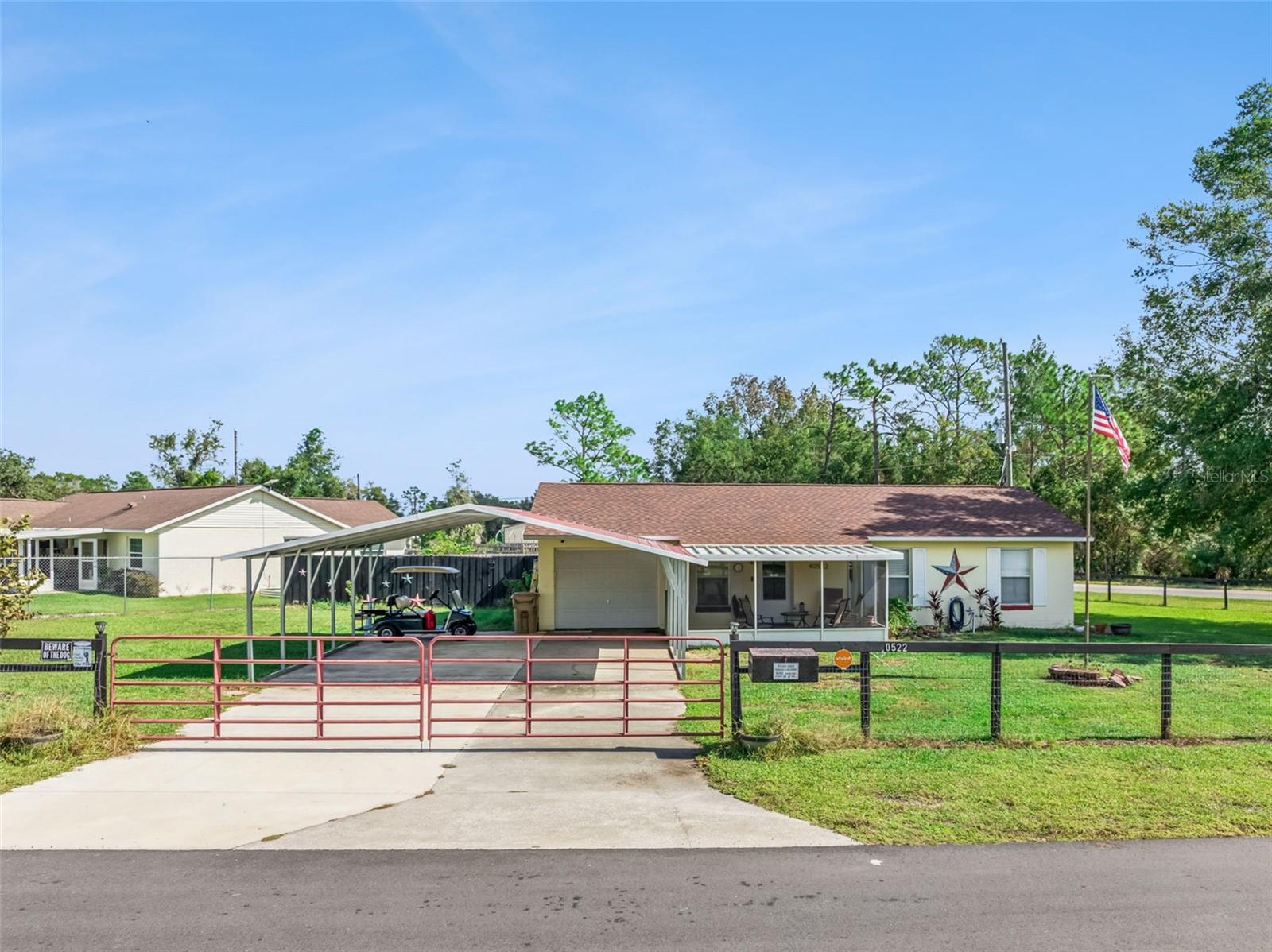 Discover this beautifully maintained 3-bedroom, 1-bath home situated on an oversized 0.45-acre corner lot in the heart of Umatilla. From the moment you arrive, the property’s inviting curb appeal sets the tone for refined country living. A large screened-in front patio welcomes you to unwind, creating the perfect transition between indoor comfort and outdoor tranquility. 

Step inside to find a lovingly cared for interior featuring a renovated bathroom, open living room and a kitchen with newer stainless-steel appliances and an inside utility room. This property features numerous upgrades, including a new roof (2023) and a new septic drain field (2023). Outdoors, the fully fenced yard provides privacy and plenty of space for leisure and entertaining. A large metal carport off the one car garage offers additional covered parking, while multiple storage sheds ensure ample room for tools, lawn equipment, or recreational items. 

With no HOA and ideally located just minutes from Umatilla you will enjoy the freedom of country living while being within easy reach of shopping and dining and everyday conveniences. 

Don’t miss this move-in-ready gem and schedule your showing today!