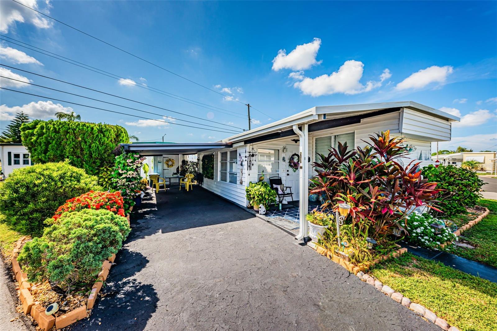 Welcome to Magnolia Manor, a highly sought-after resident-owned 5-Star 55+ community where you own your share and enjoy an affordable HOA fee of just $225 per month, with NO lot rent and no additional monthly fees! $25,000 land share price is already included in the sale price.

This charming and move-in-ready 1-bedroom, 1-bathroom home is being sold fully furnished, making it the perfect seasonal retreat or year-round residence. Inside, you'll find a spacious Florida Room that adds valuable living space, along with an oversized walk-in closet in the bedroom for ample storage. Good size eat in kitchen that overlooks the Florida room. 

Situated on a beautifully landscaped corner lot, the property features two storage sheds, covered parking, and attractive curb appeal. Just bring your suitcase and start enjoying the Florida lifestyle!

Magnolia Manor offers outstanding amenities including a clubhouse, library, fitness center, swimming pool, laundry facilities, and shuffleboard courts. The monthly HOA fee includes water, sewer, trash, and lawn maintenance, providing worry-free living and exceptional value.

Conveniently located only 5 miles from Madeira Beach (approximately a 15-minute drive) and just 3.8 miles from Publix, you'll have easy access to shopping, dining, entertainment, and Florida's beautiful Gulf Coast beaches.

No pets allowed.

Don't miss this opportunity to own an affordable piece of paradise in one of the area's most desirable resident-owned communities. Schedule your showing today—this is a MUST-SEE!