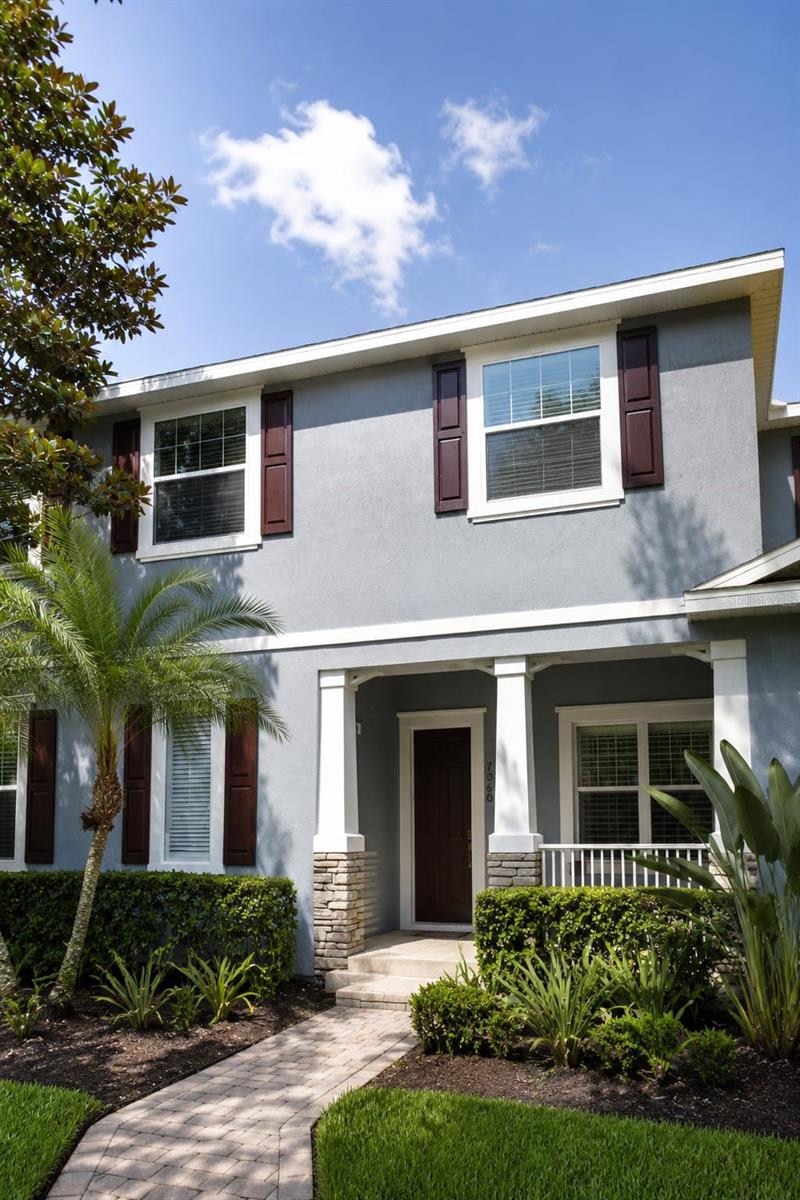 BEST VALUE TOWNHOUSE IN WINDERMERE! OUTSTANDING HOME AND LOCATION in the desirable community of Preston Square in Windermere FL. This amazingly unique 3 bedroom, 2,5 bath feels like a single family home with its large kitchen and attached 2-car garage. When you enter, you will be welcomed by the beautiful columns, hardwood floors, separate dining room, separate living room and a great paved private courtyard. Wonderful front porch overlooks the park, community pool and basketball areas. Other awesome features include crown molding, sliding door with built-in blinds, retractable ceiling fans, plantation shutters and curved archways. Expansive kitchen has plenty of 42" wood cabinets and granite countertops with backsplash and an additional eat-in-kitchen space. Master suite has large walk-in closet, tray ceiling and spacious master bath with double sink, granite countertops, wood cabinets, jetted tub and shower. Wonderfully kept community maintains ground maintenance. Close to Disney, Publix, restaurants, retail stores, major roads and excellent Windermere schools. MOVE-IN-READY. Room measurements are approximate. Must see!