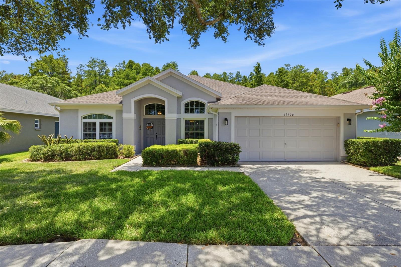 Beautiful, Immaculate & Move-In Ready Home in VillaRosa!
Welcome home to this meticulously maintained 3-bedroom, 2-bath, 2-car garage residence located in the highly desirable, family-friendly VillaRosa community and zoned for top "A" rated Steinbrenner High, Martinez Middle, and McKitrick Elementary schools (all located just outside the community). 
Enjoy peace of mind knowing that the major updates have already been completed, including a new A/C system (2025), roof replacement (2019), and hurricane-impact windows with a lifetime warranty (2013).
Upon entering, you'll be greeted by soaring ceilings, elegant archways, abundant natural light, and gorgeous hardwood flooring that create a warm and inviting atmosphere. The updated kitchen features beautiful cabinetry, quartz countertops, bar seating, and new Samsung refrigerator, dishwasher, range, and microwave. A charming breakfast nook overlooks the front yard through plantation shutters, while the kitchen opens seamlessly to the spacious great room, offering flexible furniture arrangements and effortless entertaining.
Triple sliding glass doors lead to the screened lanai and lush backyard with peaceful conservation views beyond. So, you will have no rear neighbors here, except for the occasional deer
The expansive primary suite is a true retreat, featuring tray ceilings, abundant natural light, serene conservation views, dual closets—including a large walk-in closet—and a generously sized ensuite bath with dual vanities, ample counter space, a soaking tub, and separate walk-in shower.
The secondary bedrooms are equally impressive, with the oversized second (blue) bedroom offering two closets, including a walk-in closet. The third bedroom (beige) also includes a walk-in closet. A formal dining room overlooks the front yard through plantation shutters, providing the perfect setting for gatherings and special occasions.
The interior laundry room is well-equipped with a new Samsung washer and dryer, utility sink, and ample cabinet storage. Range/stove and dryer are currently electric, but gas is available at both locations. Also, a permanent outdoor generator could be added and tapped into the gas. 
VillaRosa residents enjoy miles of scenic sidewalks and biking paths winding about tranquil ponds and conservation areas, complete with fountains, park benches, and picturesque views. Nearby VillaRosa Park offers a playground, full basketball court, two combo tennis and pickleball courts, two sand volleyball courts, horseshoes, a pavilion, and an expansive green space for recreation and outdoor activities like football, baseball, soccer or frisbee.
The community entrance is conveniently located just one-half mile from the Veterans Expressway and provides quick access to Tampa International Airport (about 18 minutes), International Plaza, downtown Tampa, and an abundance of dining, shopping, and entertainment.
This exceptional home has been meticulously and lovingly cared for by its original owner and is truly move-in ready. Schedule your private showing as soon as possible. Don't wait and be too late.