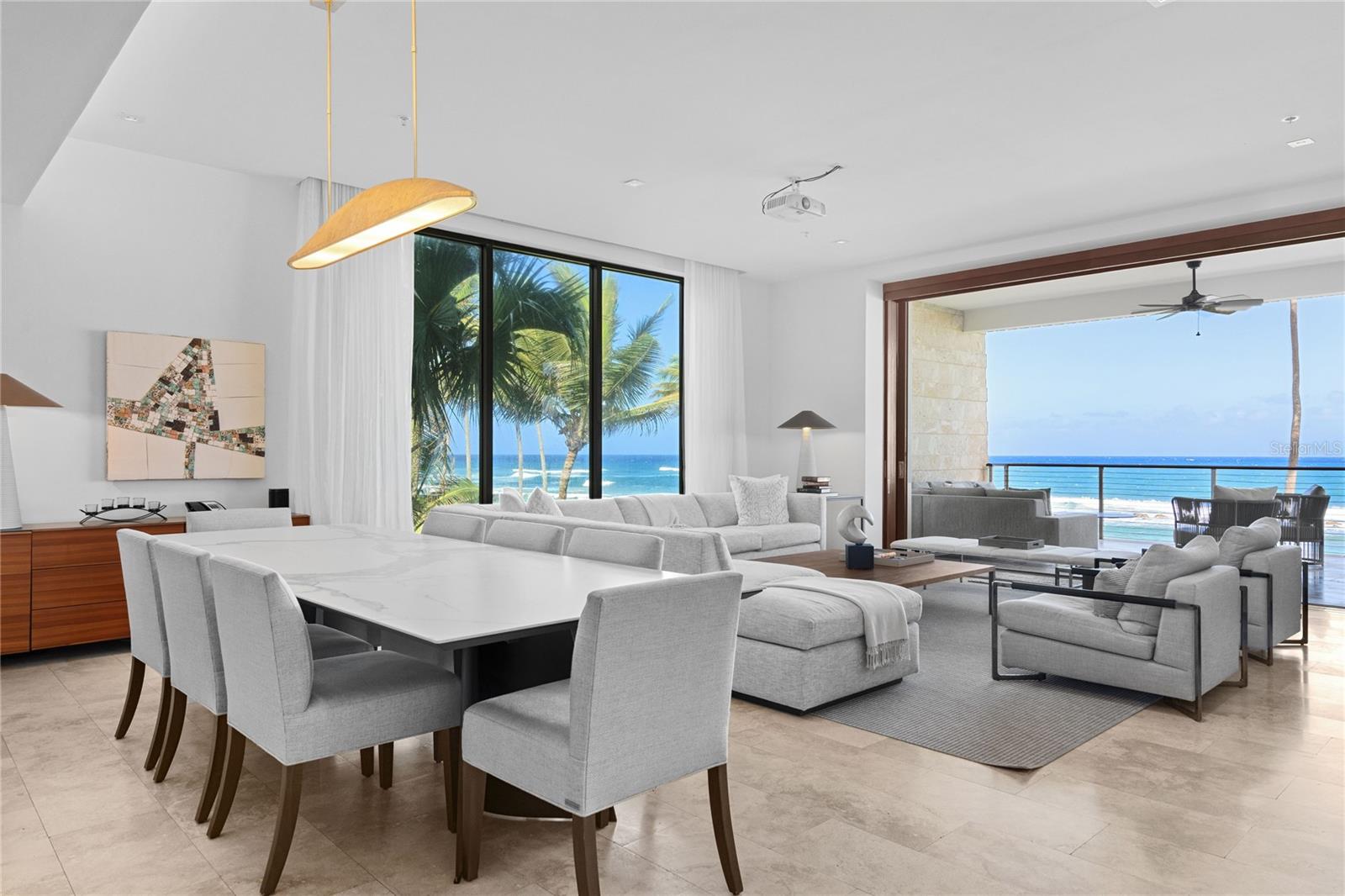 Introducing West Beach, a Ritz Carlton Reserve Residence that epitomizes coastal luxury, offering an unmatched beachfront living experience in Dorado, Puerto Rico. This exceptional condo, nestled along the pristine shores of Dorado Beach Resort, presents a rare opportunity to indulge in a harmonious blend of natural splendor and modern sophistication. Step into your personal haven and immerse yourself in the inviting ambiance of this meticulously designed residence. The expansive open-concept layout seamlessly connects the living, dining, and kitchen spaces, providing an ideal setting for entertaining guests or cherishing moments with loved ones. Floor-to-ceiling windows bathe the interior in natural light, illuminating the elegant decor and framing picturesque views of the azure ocean. The gourmet kitchen, a haven for culinary enthusiasts, showcases top-of-the-line Wolf and Sub-Zero appliances, bespoke Poliform cabinetry, and a generous island with sleek countertops, combining practicality and style for casual dining or upscale gatherings. The master suite offers a serene retreat, allowing you to unwind and recharge in privacy. Awaken to the gentle rhythm of waves and savor sunrise vistas from your private balcony. The en-suite bathroom boasts a luxurious spa-like ambiance, featuring a deep soaking tub, a spacious walk-in shower, and an outdoor shower experience. Two additional bedrooms are thoughtfully designed to ensure comfort and seclusion for family members or guests, each elegantly appointed. Wake up to mesmerizing ocean panoramas or relax in the inviting ambiance, creating your own sanctuary of calm. Immerse yourself in the exquisite allure of beachfront living at West Beach, where each day is infused with tranquility, opulence, and boundless opportunities. Seize the chance to own this remarkable property and forge enduring memories amidst the enchanting splendor of Dorado Beach.