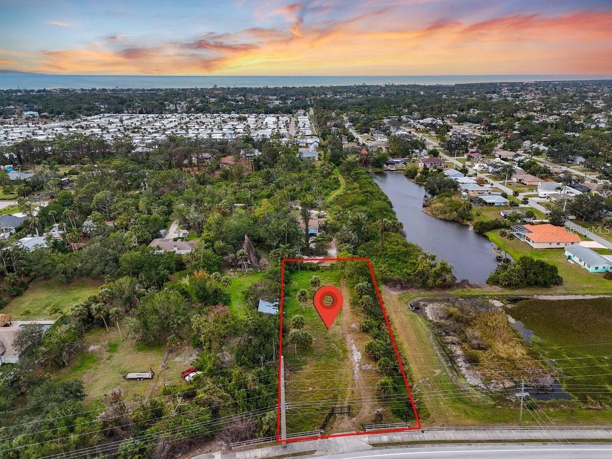 Rare opportunity to own a mostly cleared 0.72-acre buildable lot in desirable South Venice, perfect for building your dream estate home or taking advantage of its future investment potential. This beautiful property is grandfathered for the construction of a single-family home and also offers the potential for office/multi-family zoning, providing flexibility for future development. Ideally located just minutes from Manasota Beach, the Intracoastal Waterway, Venice Island, Wellen Park, Englewood, shopping, restaurants, walking trails, and nature preserves. Enjoy the benefits of no HOA, no CDD fees, low property taxes, and an X Flood Zone, where flood insurance is typically not required by lenders. Recent due diligence has already been completed, including a full Environmental Study confirming no wetlands or endangered species, confirmation of water service availability from the Water District, and a new topographical and tree survey—saving buyers valuable time and expense. Optional annual memberships to the South Venice Yacht Club and South Venice Civic Association provide access to boating amenities, a private beach ferry, pickleball courts, and additional recreational facilities. Environmental Study, Water Service Letter, and survey are available upon request.