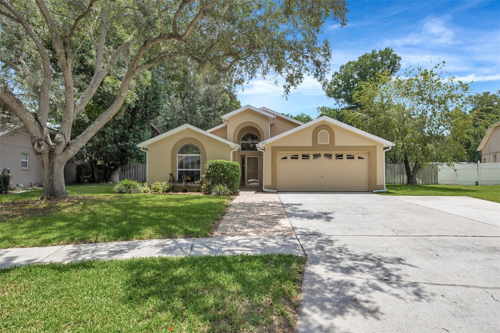 Nestled in the established Buckhorn community, this fresh and friendly 3 bed, 2 bath offers cheery sightlines and volume ceilings that upon entering allow you to breathe easy. This home is truly move-in ready! You are greeted by new luxury vinyl plank floors adorned with fresh paint throughout. As you enter, your eyes are immediately directed outdoors to a grand lanai/patio overlooking a refreshing swimming oasis with spa and a privacy Florida-glass screened enclosure. This home is an entertainer's delight! After a full day of swimming, relax and have fun with friends and family in your expansive family room that adjoins an open kitchen, formal living and eat-in areas. Kitchen is complete with stainless steel appliances surrounded by beautiful wood cabinets with granite countertops that stretch on and on creating great prep space alongside a handy breakfast bar. Enjoy your formal living with a wood burning fireplace and mantle ready to decorate. The extra-large family room that adjoins other living areas or be separated to create privacy with double pocket doors. It creates the ideal flex space for entertaining, a media room, home office, or playroom. This thoughtful floorplan boasts a primary bedroom with ample space for king accommodations and a newly remodeled bathroom and spacious walk-in closet. Situated on a desirable pie-shaped, oversized lot with two good-sized side yards that you will love for gardening, recreation or simply taking in the Florida lifestyle. A new high-end Halo Full Treatment water filltration system along with water softener will pamper you. Newer roof and A/C with new ductwork and bipolar ionizer will give you peace of mind. Optional HOA and No CDD. Conveniently located near not one, but two Publix Supermarkets, Sprouts and a Whole Foods coming soon. Just around the corner is the YMCA, Bay Care Healthplex, Harbor Freight and your choice of multiple Home Depots and Lowe's. All this, strategically located between Tampa and Orlando. This home offers both tranquility and accessibility in one exceptional package.