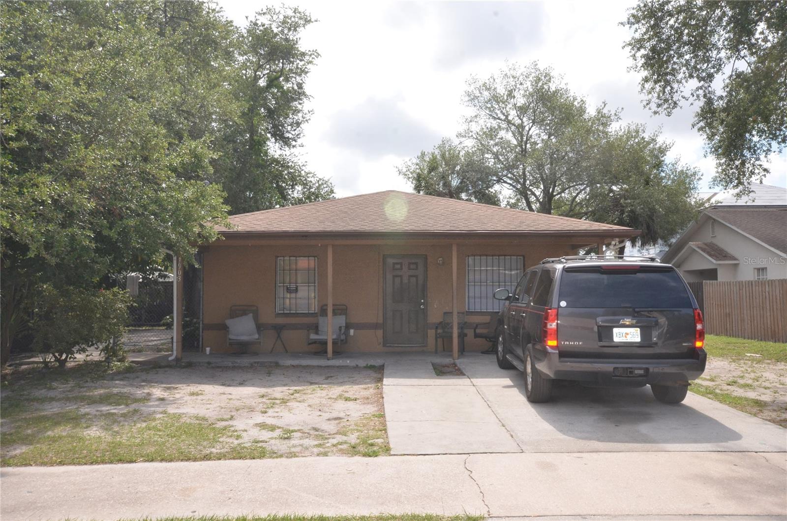 Investor Opportunity in East Tampa! Welcome to 1903 E 23rd Ave, a solid income-producing property with a tenant in place making it an excellent opportunity for those seeking immediate cash flow. This spacious 3-bedroom, 1.5-bath home features an open-concept layout with a large living room and dining area, creating a comfortable and functional living space. The primary bedroom offers a convenient Jack-and-Jill bathroom configuration, while the open kitchen provides ample cabinet space and includes a stove and refrigerator. An interior laundry area adds everyday convenience. Major improvements include a roof replaced in 2020 and A/C installed in 2017, helping reduce near-term maintenance concerns. Situated on a large corner lot with a generous yard, the property offers additional outdoor space and future potential. Conveniently located near Downtown Tampa, Ybor City, major highways, shopping, dining, and employment centers, this property is well-positioned for both current income and long-term growth. Appointment only. Please do not disturb tenant.