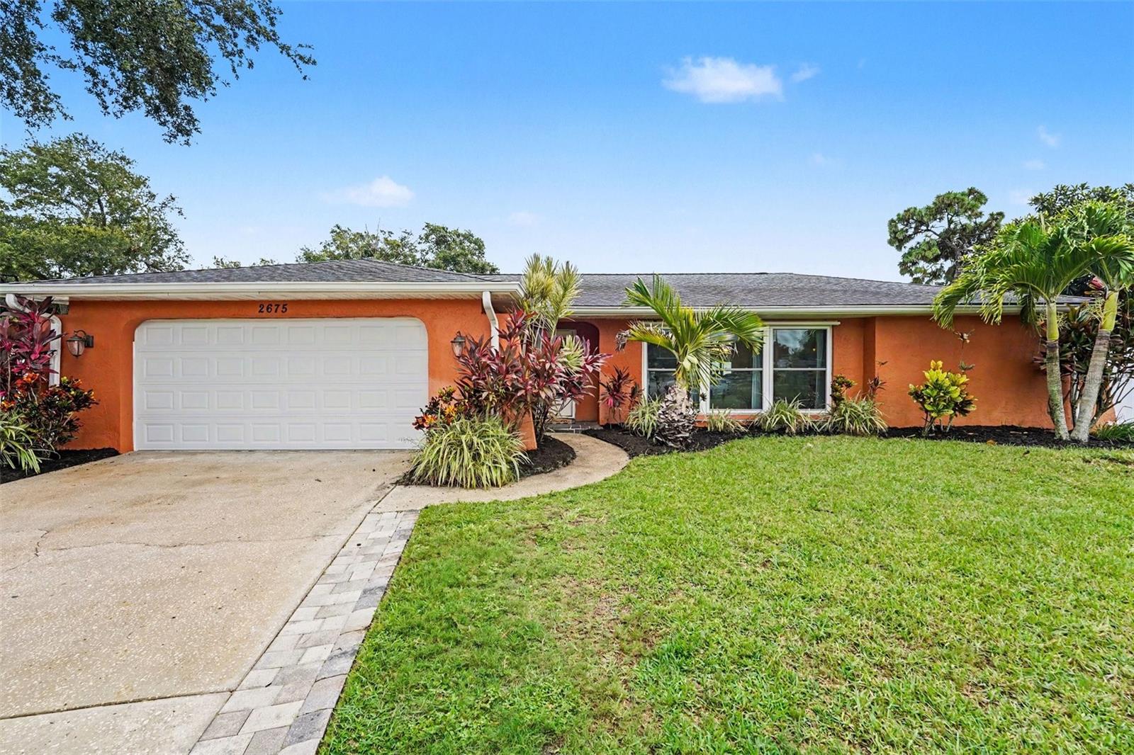 Nestled on a quiet cul-de-sac in the sought-after Countryside area, this beautifully updated pool home sits on an oversized pie-shaped lot with scenic golf course views, offering a rare combination of privacy and space. Located in a no flood zone, you’ll enjoy added peace of mind without sacrificing convenience. The thoughtfully designed split floor plan provides added privacy, with the primary suite featuring a walk-in closet and a spacious en-suite bathroom. At the heart of the home, the kitchen flows seamlessly into the dining area and family room, creating an open, welcoming space that’s perfect for everyday living and entertaining. Whether hosting holiday gatherings or enjoying a quiet evening at home, the layout is designed to bring everyone together. Step outside to your own private backyard retreat featuring a screened pool, a spacious fenced yard, and plenty of room to relax, entertain, or enjoy the Florida sunshine. Ideally located just minutes from Clearwater Beach, Honeymoon Island, downtown Dunedin, Countryside Mall, and the Pinellas Trail, this home offers convenient access to shopping, dining, recreation, and some of the area’s most popular destinations. Click the Virtual Tour link to view the 3D walkthrough. Discounted rate options and no lender fee future refinancing may be available for qualified buyers of this home.
