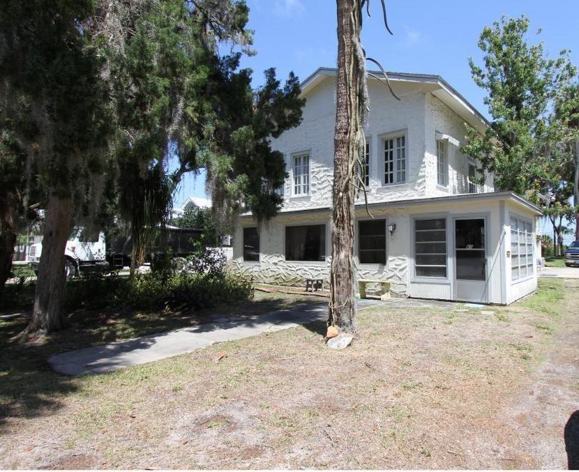 Riverside Drive lot with Riparian Rights stretches over 200 feet with endless views. Property stretches from Faulkner to Riverside Drive with a Faulkner Street address. City-owned land on waterfront East side of street, with dock permits typically granted. Existing home is a LARGE 3bed/2.5 bath, large flex room with balcony full of a lifetime of memories and treasures, however has no monetary value and needs to be razed.  Property is being sold as vacant land. No showings until acceptable offer. . Located in the heart of NSB and walking distance to both beachside Flagler AVe and Downtown Canal Street with an abundance of boutiques, shops, restaurants, fishing, biking, roller blading, paddle boarding and everything in between. Make this unique piece of old Florida charm lot/home your own NSBLIfestyles. Great place to raise your family; to live the lifestyles of NSB and create memories.; Cleared: Partial ;Water: Available at Site