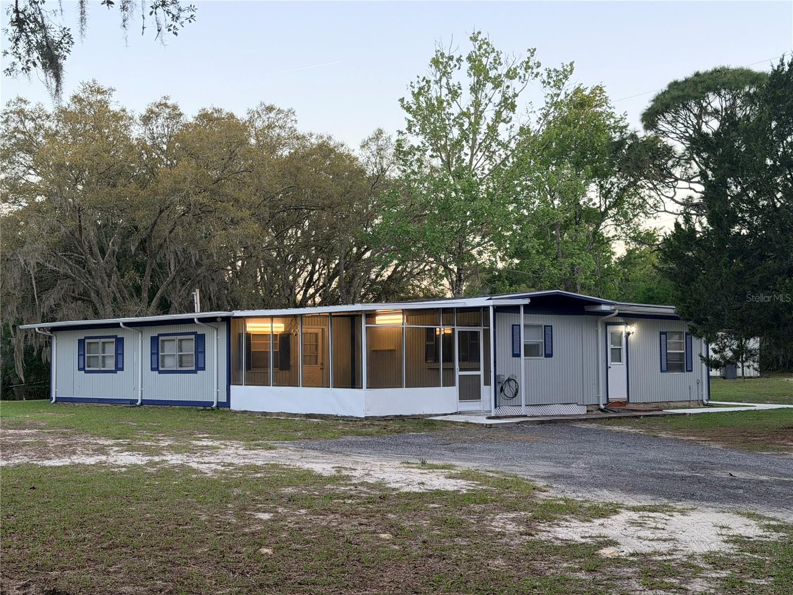 Move-in ready and packed with over $100,000 in upgrades, this beautifully updated home on 1.25 acres offers the perfect blend of modern comfort and peaceful living in Hernando. GREAT FOR INCOME/INVESTMENT PROPERTY!!! Featuring a large workshop, fully fenced property, and cleared land, this home is ideal for those seeking space and functionality. MINUTES FROM LOCAL SHOPS, COFFEE & RESTAURANTS. Major improvements include 2022 updates such as a NEW ROOF all new FLOORING, LIGHT FIXTURES interior PAINT. In 2023 upgrades include an UPGRADED Frigidaire and Samsung stainless steel APPLIANCES and range hood. In 2024, the exterior was freshly painted, NEW GUTTERS were installed, and a MILLINGS DRIVEWAY was added. Recent enhancements include a NEW SPLIT UNIT and upgraded 220-AMP RV/Tesla hookup, along with a SMART THERMOSTAT, NEW BLINDS on all WINDOWS, electrical plate updates, and screened lanai improvements (2026). Enjoy added features like a new entry gate and modern lighting throughout. Located in a FEMA X zone and ideally situated near the Withlacoochee State Trail, as well as Crystal River and the World Equestrian Center, this property offers a quiet lifestyle with convenient access to outdoor recreation and everything Citrus County has to see.