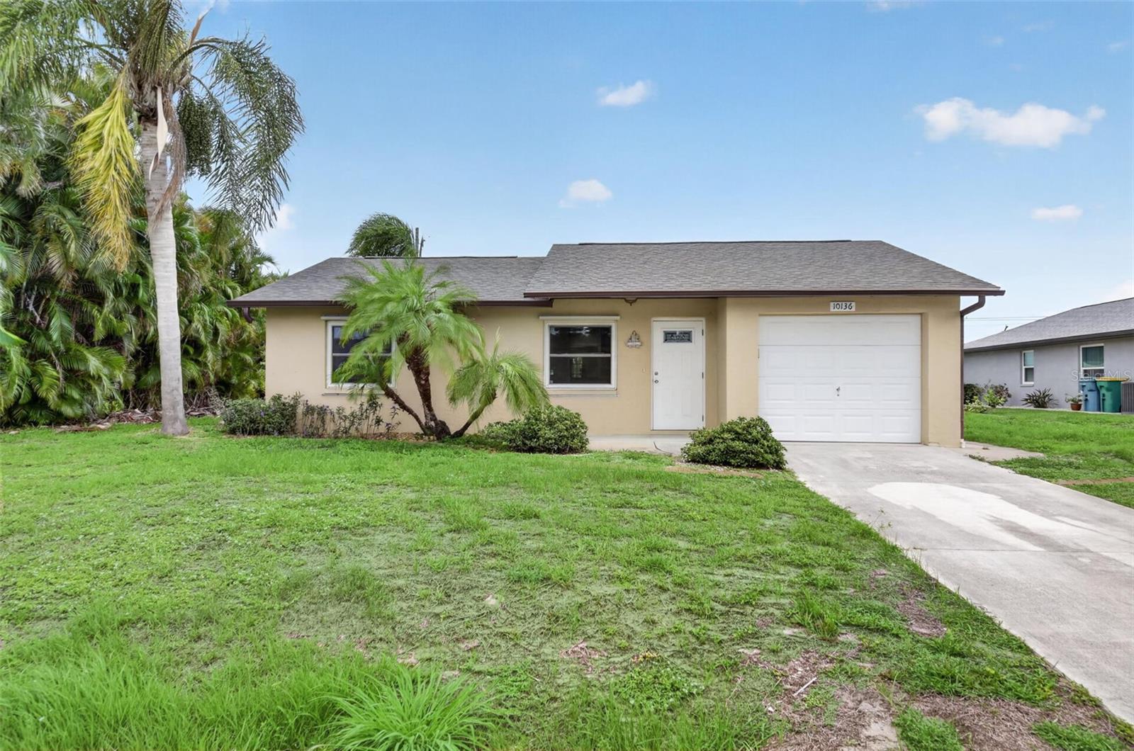 Virtually Staged. Welcome to your slice of Florida living! Perfectly located just 15 minutes from the beautiful Gulf beaches, this charming move-in-ready home offers the freedom you’ve been looking for with NO HOA and NO CDD fees — bring your boat, jet skis, RV, work trailer, or all your outdoor toys with ease!
Built in 1980 and offering 1,254 sq ft of comfortable living space, this well-maintained home features 2 bedrooms, 1 bathroom, a 1-car garage, plus a large and versatile bonus room with vaulted ceilings that can easily serve as a third bedroom, home office, gym, hobby room, or guest retreat. French doors from the bonus room lead directly to the enclosed screened lanai, creating the perfect indoor-outdoor Florida lifestyle.
Inside, you’ll love the fresh interior paint, beautiful tile flooring throughout with NO carpet, ceiling fans throughout, and an inviting layout designed for both everyday comfort and entertaining. The kitchen features warm-tone cabinetry, granite countertops, and a convenient pass-through window overlooking the separate dining room, creating an open and connected feel ideal for gatherings and daily living. An arched doorway adds character and charm to the dining area, while the linen closet provides additional storage space.
The bathroom has been tastefully updated with a tiled-to-the-ceiling shower and elegant glass shower doors. Step outside and enjoy the large sunny backyard with plenty of room for entertaining, gardening, pets, or simply relaxing in the Florida sunshine.
Major updates include a NEW ROOF in 2024, offering peace of mind for years to come. Additional exterior features include an irrigation system for added convenience in maintaining the lawn and landscaping.
Whether you’re a first-time homebuyer, snowbird searching for the perfect Florida retreat, investor looking for a rental opportunity, or someone needing extra parking and flexibility for a business or recreational lifestyle, this property checks all the boxes. Conveniently located near beaches, shopping, dining, and entertainment, this home combines flexibility, functionality, and Florida charm all in one!