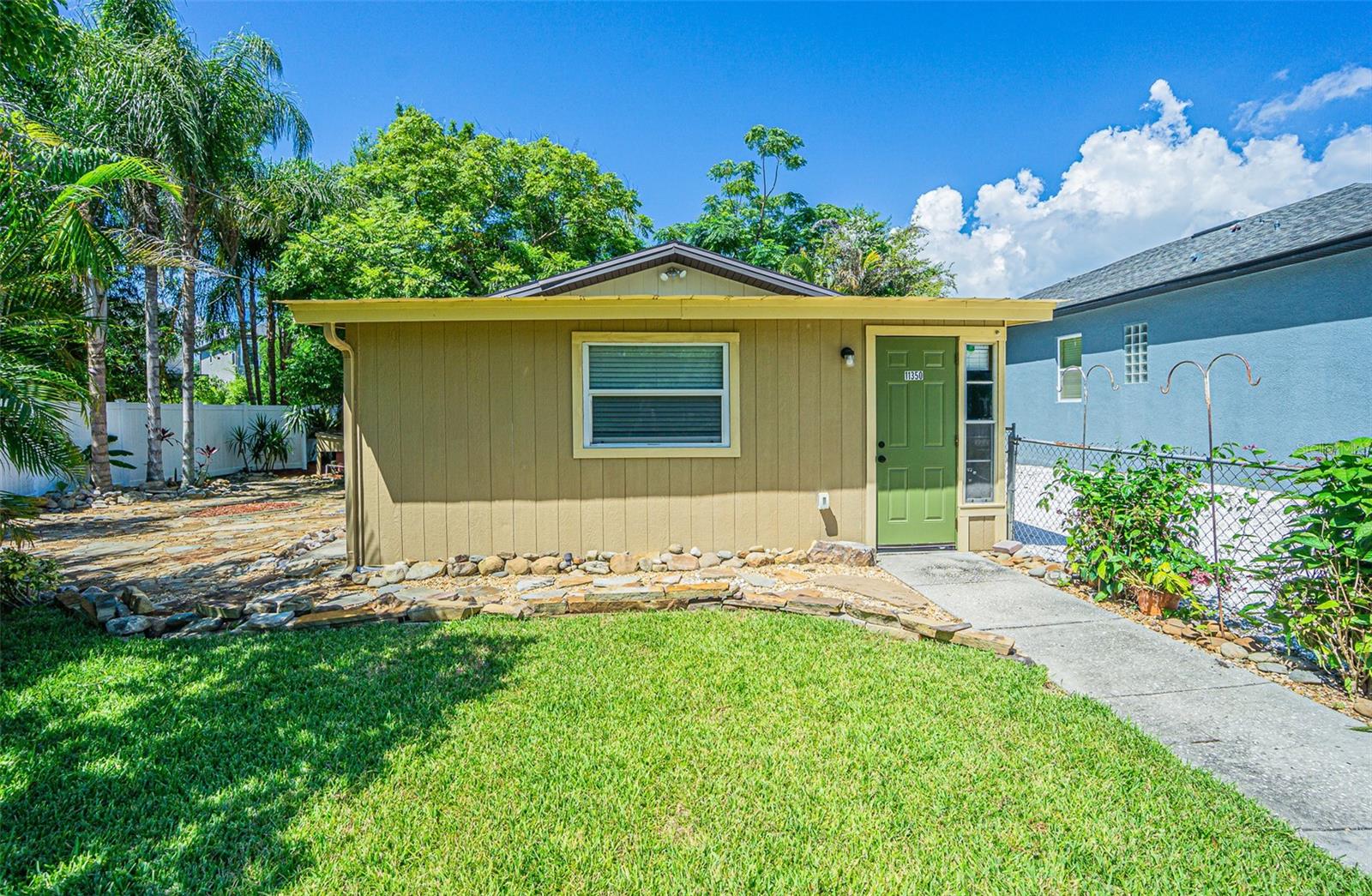 Exceptional Income-Producing Property in the Westchase Area! Discover a rare opportunity to own two detached residences on a spacious 7,500-square-foot lot in one of Tampa’s most sought-after locations. Situated between Westchase and Countryway, this versatile property offers endless possibilities for investors, multi-generational living, or buyers seeking supplemental rental income—all with NO HOA restrictions. The front residence features approximately 520 square feet of thoughtfully updated living space, including a newer roof, brand-new central air and heating system, upgraded electrical and plumbing, a beautifully remodeled kitchen with new cabinetry and induction range, and a renovated bathroom. The rear residence offers approximately 515 square feet and includes a private bathroom, and a new mini-split air conditioning system. An expansive enclosed porch adds valuable living and entertaining space, creating a welcoming retreat for residents or guests. Recent improvements throughout the property include fresh interior and exterior paint, new fencing, professionally installed turf, and a sprinkler system supplied by a dedicated well pump. The lush landscaping and mature garden areas provide a peaceful outdoor setting ideal for relaxing, entertaining, or weekend barbecues. Parking is abundant, with room for 4-5 vehicles, including space for a boat, RV, or other recreational equipment. Conveniently located just minutes from Tampa International Airport, major shopping centers, restaurants, schools, and commuter routes, this property offers unmatched accessibility. Residents will enjoy close proximity to Target, Publix, Walmart, Upper Tampa Bay Park, Philippe Park, George M. Steinbrenner Field, Safety Harbor, Dunedin, Palm Harbor, Clearwater Beach, and Honeymoon Island. The property is currently vacant, allowing a seamless transition for owner-occupants or investors without existing lease obligations. Whether you’re looking to expand your investment portfolio, create a multi-family living arrangement, or enjoy a low-maintenance lifestyle in a prime Tampa location, this unique property is ready for its next owner.