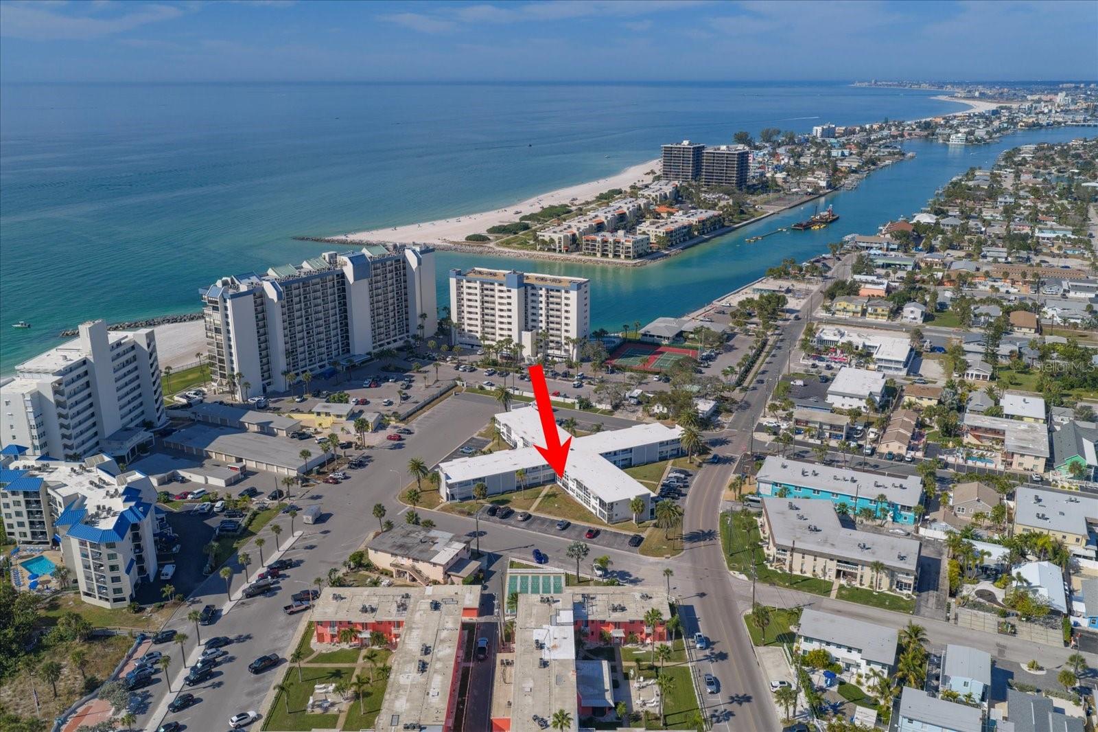 **FULLY REMODELED in 2025!**SELLER IS OFFERING $3500 TOWARDS BUYER'S CLOSING COSTS.** This stylish 1BR/1BA condo is perfectly positioned on the first floor, right across the street from ST. PETE BEACH in the coveted UPHAM BEACH area- ideal for a WEEKEND GETAWAY or FULL-TIME RESIDENCE. Enjoy an inviting OPEN FLOOR PLAN, LUXURY VINYL FLOORING, and a BEAUTIFULLY UPDATED KITCHEN featuring STAINLESS STEEL APPLIANCES, TUXEDO-STYLE CABINETRY (BLUE LOWERS & WHITE UPPERS), NATURAL STONE COUNTERTOP (Quartzite), WINE DISPLAY SHELVES, and a spacious PANTRY CLOSET. The modern bathroom offers a **WALK-IN SHOWER** and stunning PORCELAIN PENNY TILE FLOORING. The LARGE BEDROOM includes a generously-sized closet with built-in shelving. There is also a SPACIOUS LINEN and ENTRY CLOSET for EXTRA STORAGE. Relax on the 12x7 COVERED/SCREENED PATIO- perfect place to soak in the gulf breeze & sunsetS. Take comfort in HURRICAN SHUTTERS that open with a flip of a switch. Additional perks include CEILING FANS, EXTERIOR HALL STORAGE for beach gear, on-site laundry, and private resident parking for up to 2 vehicles. Condo fees include CABLE, INTERNET & FLOOD INSURANCE. A 3-month rental minimum provides excellent flexibility. With Cory Ave. restaurants, shops, Sunset Park Fishing, Sunday Farmer’s Market, and the beach just steps away—and Downtown St. Pete only 15 minutes by car or by Central Avenue Trolly—this location captures the very best of FLORIDA COASTAL LIVING. MOVE-IN READY, FULLY/FURNISHED/TURNKEY and BEAUTIFULLY UPDATED, this BEACHSIDE GEM is a must-see!
