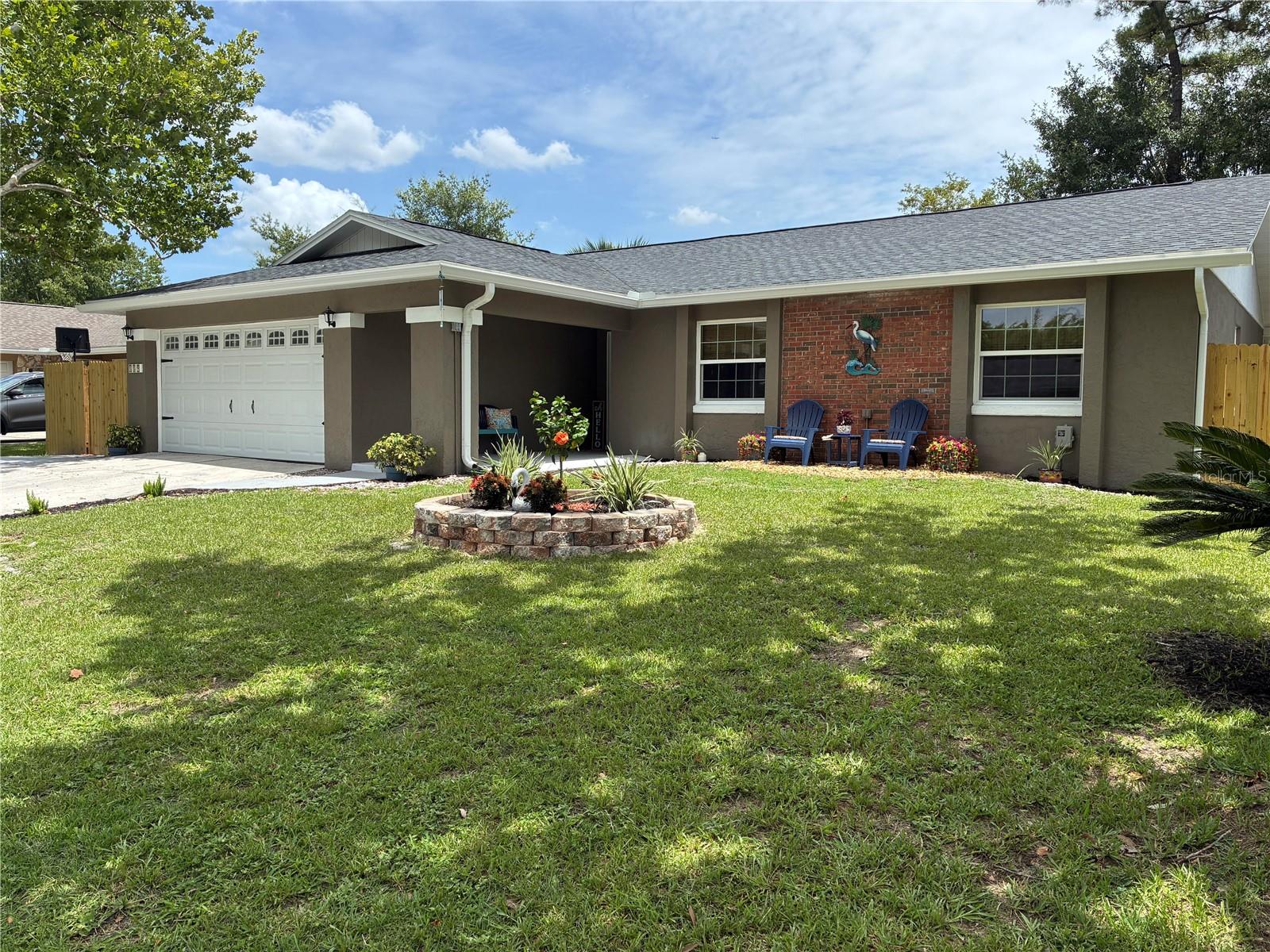 Welcome home to this beautifully renovated 4-bedroom, 2-bath residence offering approximately 2,250 square feet of thoughtfully designed living space in the highly desirable Oak Forest subdivision. From the moment you arrive, you'll appreciate the exceptional care and attention to detail that make this home truly move-in ready.
The open-concept floor plan creates a bright and inviting atmosphere, perfect for both everyday living and entertaining. Luxury vinyl and tile flooring flow throughout the home, providing style, durability, and easy maintenance with no carpet to worry about.

At the heart of the home is a stunning, fully renovated kitchen featuring quartz countertops, soft-close cabinetry, convenient pull-out drawers, and high-quality appliances that will delight any home chef. The spacious living and dining areas seamlessly connect to the Family Room, where vaulted ceilings, abundant windows, and natural light create a warm and welcoming gathering space. A wet bar complete with a bar refrigerator makes entertaining family and friends effortless.

The spacious primary suite offers a beautifully updated bathroom with quartz countertops and a luxurious walk-in shower featuring a rainfall shower head. The secondary bedrooms are generously sized, and the guest bathroom has also been tastefully renovated with quality finishes.

Step outside to your backyard retreat, thoughtfully designed for relaxation and entertaining while the cozy fire pit creates the perfect setting for enjoying cool Florida evenings.

Major updates provide peace of mind for years to come, including a new roof installed in 2026, new soffits and gutters, new windows, a new water heater, complete repiping, and a new electrical breaker panel, AC installed in 2020.  The garage floor has been freshly coated, adding to the home's clean and polished appearance.

Ideally located near shopping, restaurants, medical facilities, and major roadways including SR 436, SR 434, and SR 417, this home offers exceptional convenience for commuting and daily living. Residents will also appreciate access to highly regarded schools.

This meticulously maintained home combines modern upgrades, quality craftsmanship, exceptional outdoor living space, and an unbeatable location—making it a rare opportunity in Oak Forest.