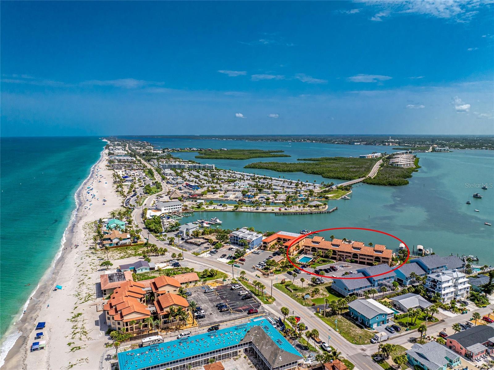 El Galeon South Condominium with Deeded Beach Access, New Lighted Boat Docks with no Bridges out to the Gulf, and Beautiful Lemon Bay Views on Manasota Key! Wake up to the sunrise over Lemon Bay, spend the day on the water, and enjoy the beach just steps away in this beautifully remodeled 1 bedroom, 1 bathroom unit. Being sold furnished, this move-in ready property features impact windows, a 2023 roof, and a bright open floor plan designed to capture the beautiful views of Lemon Bay and the Intracoastal Waterway. A large double sliding glass door opens to the private waterfront balcony, while a combination of tile and luxury vinyl flooring, crown molding, and a convenient foyer storage closet add style and functionality throughout. The updated kitchen features wood soft close cabinetry, epoxy-resin countertops, cabinetry on both sides of the breakfast counter for added storage, and white appliances. The spacious bedroom includes a reach-in closet, while the remodeled bathroom offers a walk-in tiled shower complete with a built-in bench, built-in shelving, and a grab bar. Additional improvements include a 2023 air conditioning system, 2023 hot water heater, updated electrical wiring inside and out making this home truly move-in ready. Outside your door, El Galeon South has recently completed ten new lighted community boat docks, while residents enjoy deeded beach access directly across Gulf Boulevard, a heated community pool, fishing pier, BBQ area, laundry facilities, and beautifully maintained grounds. Weekly rentals are permitted, making this an excellent opportunity as a seasonal getaway, full time residence, or income producing investment. The condominium fee provides exceptional value by covering flood and building insurance, roof maintenance, exterior maintenance and painting, grounds maintenance and irrigation, pest control, internet, community pool maintenance, and reserves, allowing you to spend more time enjoying everything Manasota Key has to offer. Just moments from waterfront restaurants, live entertainment, marinas, boat and jet ski rentals, and the white sand beaches that make Manasota Key one of Southwest Florida's favorite island destinations, this is the waterfront lifestyle you've been waiting for. Come experience everything El Galeon South has to offer at 1765 Gulf Boulevard #203.