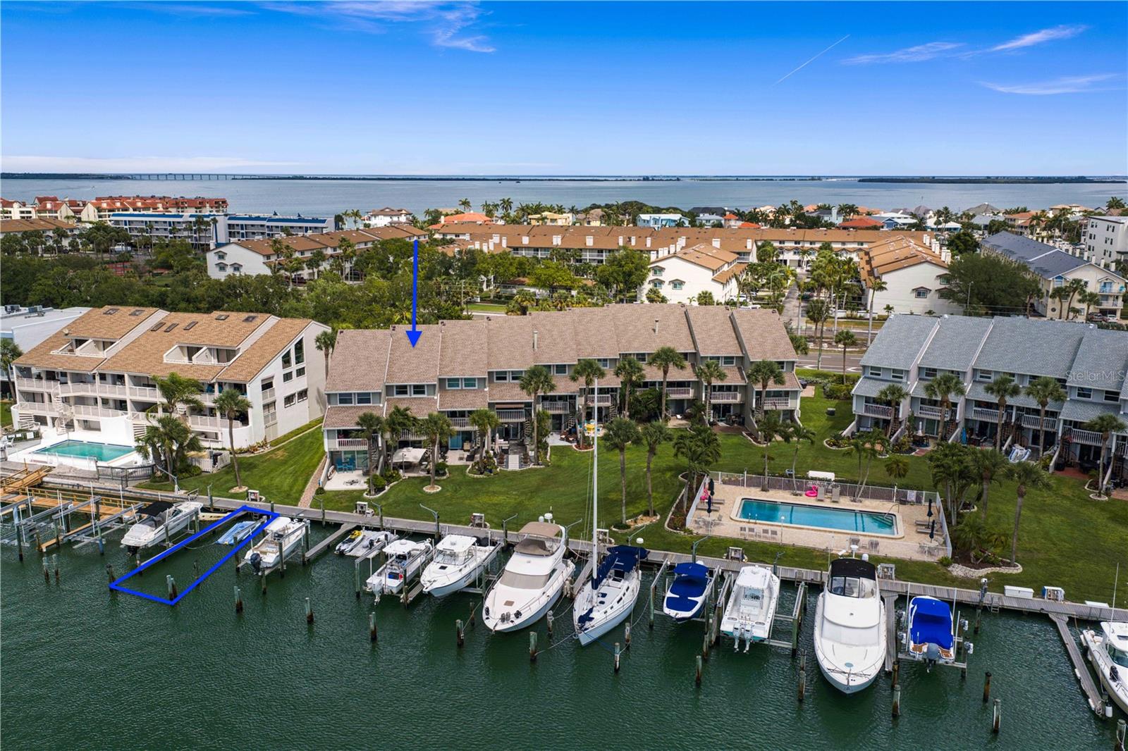 Welcome to waterfront living at Pine Key Lodge in the heart of Tierra Verde! This beautifully updated townhome-style condo offers 3 bedrooms, 2.5 baths, a bonus room, a 1-car garage + additional parking space, and 1943 square feet of coastal living with multiple water views and abundant natural light throughout. Perfectly positioned on the Grand Canal with no fixed bridges, this property includes a PRIVATE BOAT SLIP with quick access to the Gulf—making it an ideal setup for boating enthusiasts. The layout is designed for both privacy and functionality across four levels. The ground floor features a private garage and a versatile bonus room that features a half bath which opens directly to the water, complete with a beautiful patio and yard space - perfect for relaxing or launching a day on the water. On the second floor, the main living area brings it all together with an updated kitchen (all wood cabinets, stone countertops, and stainless steel appliances), guest bedroom, and full bath, creating an open and comfortable space for entertaining or everyday living. The third level includes a loft-style flex space ideal for a home office or reading nook, along with the primary suite featuring an updated bathroom. The top floor completes the home with a spacious third bedroom offering dual closets, making it ideal for guests or a second primary setup.  
Within the community, you’ll find a beautifully maintained waterfront setting that reflects pride of ownership throughout. Residents enjoy a sparkling pool overlooking the water, creating the perfect spot to relax, unwind, and take in the coastal surroundings. Enjoy the convenience of condo living with the feel of a private waterfront home, all within one of Tierra Verde’s most desirable boating communities. Whether you're heading out by boat for the day or enjoying sunset water views from home, this is the Florida lifestyle you've been waiting for. Just minutes from Fort DeSoto Park, St. Pete Beach, and the lively energy of downtown St. Petersburg—home to rooftop bars, acclaimed dining, world-class museums, waterfront parks, and the iconic St. Pete Pier—this residence puts you right in the heart of everything that makes Tampa Bay so desirable. Call today to schedule your private showing!