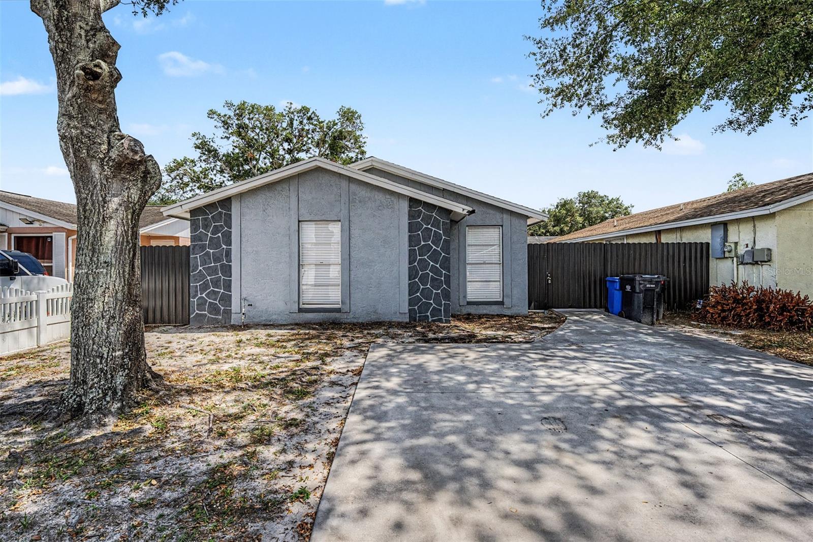 Welcome to this beautifully renovated 3-bedroom, 2-bath home nestled in the desirable Town N’ Country area. Designed with comfort and style in mind, this move-in ready residence offers a bright open layout, modern finishes, and thoughtful upgrades throughout. The stunning kitchen features granite countertops, custom cabinetry, and stainless steel appliances, seamlessly connecting to the main living spaces for easy everyday living and entertaining. Both bathrooms have been tastefully updated, while the spacious primary suite offers a relaxing private retreat. Step outside to enjoy the cozy backyard, perfect for weekend gatherings or quiet evenings at home. Conveniently located near Tampa International Airport, shopping, dining, and major highways, this home combines modern living with an unbeatable location. No HOA and no flood insurance required.