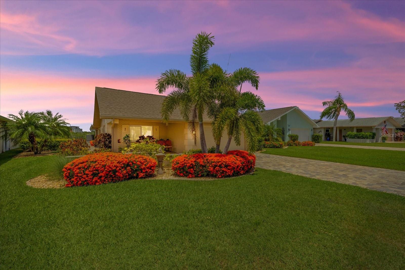 Experience the best of Florida waterfront living in this beautifully updated 3-bedroom, 2-bath, 2-car garage home nestled on a picturesque wide saltwater canal in the highly sought-after, deed-restricted community of Gulf Harbors Woodlands.

Designed for both everyday comfort and effortless entertaining, the spacious split-bedroom floor plan offers nearly 2,000 square feet of living space highlighted by soaring ceilings, abundant natural light, and a warm wood-burning fireplace. At the heart of the home is an expansive, updated kitchen featuring generous cabinetry, ample counter space, stainless steel appliances, and plenty of room for gathering with family and friends.

The private primary suite is a true waterfront retreat, where you’ll enjoy peaceful canal views right from your bed, a spacious walk-in closet, and an en-suite bath designed for comfort and privacy.

Step outside to your own tropical oasis where beautifully landscaped grounds lead to an expansive waterfront patio, composite floating dock, and kayak rack—perfect for launching a morning paddle, fishing from your backyard, or simply relaxing while taking in the tranquil water views. Two zone manual irrigation system. With direct Gulf access and no fixed bridges, boating enthusiasts can enjoy easy access to the open Gulf of Mexico.

This home also offers exceptional peace of mind with numerous valuable improvements, including:

Flood barrier system
Impact-rated windows and doors
whole home replumbed with pex
Roof replaced in 2017
Impact windows and doors installed in 2017
Air conditioner replaced in 2024/2025
Composite floating dock 10 x 12

Residents of Gulf Harbors Woodlands enjoy a mandatory HOA of $190 per quarter, providing access to outstanding community amenities including a clubhouse, heated swimming pool, tennis courts, pickleball courts, and a private community boat ramp. Homeowners also have the opportunity to join the nearby Gulf Harbors Private Beach Club for a separate annual fee, offering exclusive access to one of the area’s most unique private Gulf-front beaches.

Conveniently located just minutes from historic downtown New Port Richey, waterfront restaurants, shopping, parks, and entertainment, this home offers the perfect combination of waterfront lifestyle, quality updates, and everyday convenience.

Come discover why Gulf Harbors Woodlands remains one of the area’s most desirable waterfront communities.