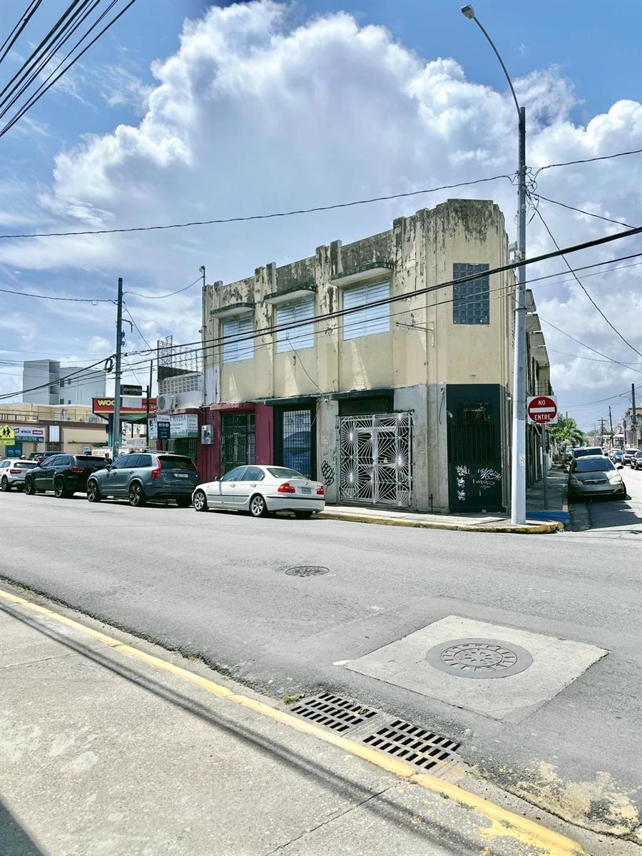Mixed-use commercial property located on a corner lot along Calle Loíza, San Juan, PR. The structure offers a total of 5,954 square feet of construction on a 268 square meter lot.
The building is distributed over two levels: the ground floor consists of three (3) commercial spaces with excellent exposure and visibility, while the second level features two (2) residential apartment units.
The property includes four (4) electric meters and five (5) water meters, allowing for flexible utility allocation across units.
Zoning allows for mixed-use (commercial/residential). The property requires full renovation, making it ideal for investors or developers seeking to reposition the asset and maximize income potential.
Strategically located on one of the city’s most active commercial corridors, with high vehicular and pedestrian traffic, surrounded by restaurants, retail, and ongoing development.
Property is being sold “as-is”.