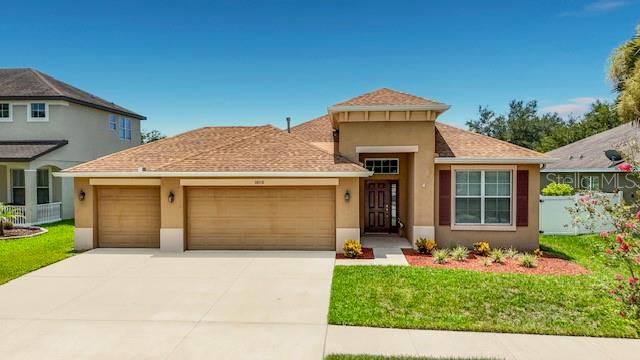 Welcome to 10110 Holland Road in the heart of Riverview, where comfort, style, and functionality come together in this beautifully maintained, move-in-ready home. Built in 2014, this spacious residence offers 3 bedrooms, 2 bathrooms, a versatile den/home office, and an oversized 3-car garage, providing plenty of room for today's lifestyle.

From the moment you arrive, you'll be impressed by the home's elegant curb appeal. A stunning rotunda entry accented with a beautiful chandelier creates a grand first impression and sets the tone for the thoughtfully designed interior. The open, split-bedroom floor plan provides both privacy and seamless flow, making it ideal for everyday living and entertaining.

The well-appointed kitchen is sure to impress with granite countertops, abundant wood cabinetry featuring crown molding, stainless steel appliances, recessed lighting, tile flooring, and a cozy breakfast nook overlooking the living space. The home is equipped with natural gas for the heating system and water heater, offering increased energy efficiency and lower utility costs. A gas connection is also available for the range, giving you the flexibility to upgrade from electric if desired.

The spacious great room is filled with natural light and features sliding curtain panels for added privacy. Open the pocket sliding glass doors to extend your living space onto the expansive 20-foot covered and screened lanai—the perfect place to enjoy your morning coffee, relax with family, or entertain guests year-round while overlooking the fenced backyard.

The private owner's suite is a true retreat, complete with dual walk-in closets, a luxurious en-suite bathroom featuring granite countertops, dual vanities, a relaxing garden tub, and a separate walk-in shower. Two generously sized secondary bedrooms are located on the opposite side of the home, offering privacy for family or guests, along with a full bathroom finished with granite countertops. The additional den provides the flexibility to serve as a home office, playroom, media room, or even a fourth bedroom option to fit your needs.

Additional features include hurricane shutters, window blinds throughout, extra storage in the back yard, a full irrigation system to keep the landscaping lush year-round, and a fully fenced backyard that's perfect for pets, play, or outdoor gatherings.

Conveniently located just minutes from I-75 and US-301, this home offers easy access to shopping, dining, schools, hospitals, Tampa, MacDill Air Force Base, and the area's beautiful Gulf Coast beaches. Combining an exceptional layout, quality finishes, energy-efficient features, and an unbeatable location, 10110 Holland Road is a home you'll be proud to call your own.

Schedule your private showing today and experience everything this exceptional Riverview home has to offer!