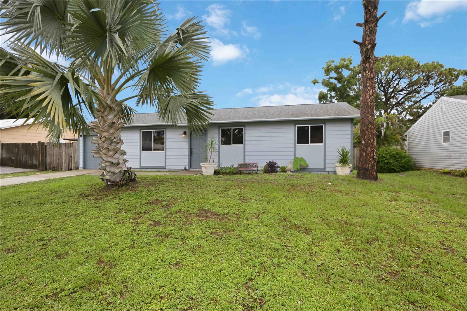 Welcome to this beautifully updated Sarasota home where modern style meets comfort and functionality. With over $45,000 in recent upgrades, this move-in-ready property offers peace of mind and exceptional value.

Step inside to an inviting open-concept floor plan featuring gorgeous luxury vinyl flooring, contemporary lighting, and abundant natural light throughout. The updated kitchen is the heart of the home, showcasing modern cabinetry, updated countertops, and newer appliances—perfect for everyday living and entertaining. Both bathrooms have also been tastefully renovated with stylish finishes.

Major improvements include a new roof (2022), newer air conditioning system, and new sewer lines, providing years of worry-free ownership.

Outside, you'll discover your own private backyard retreat. The beautifully landscaped, fully fenced yard offers the perfect setting to relax or entertain with a spacious deck, cozy fire pit, and a tranquil koi pond that creates a peaceful outdoor oasis.

Conveniently located near shopping, dining, parks, beaches in the heart of Sarasota, this meticulously maintained home is ready for its next owner. Don't miss your opportunity to own this exceptional property—schedule your private showing today!