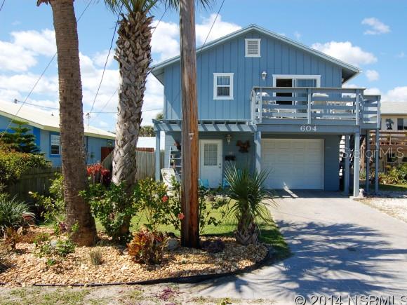 BEACHSIDE 4BED/3 BATH W/ IN-LAW SUITE- Bright & breezy, this  well maintained  home sits on the north part of beachside, centrally located to everything- the sparkling waters of the Atlantic & drive-on beach sits at the end of the street, with the option of either walk-over access for pedestrians or drive-on ramps nearby. walking distance to shopping, dining & entertainment on Flagler Ave, mainland access via the north & south causeway bridges, public fishing dock on the intracoastal within walking distance, & bustling 3rd Ave shops/restaurants just 5 minutes away. Main living area & bedrooms on 2nd floor, open plan living room with wood burning brick fireplace, updated kitchen w/ glass tile backsplash, breakfast bar & new stainless appliances. 2 balconies/sun porches; one in the front facing east, & another off the back guest rooms running the full length of the house. Cozy master suite, w/ updated bathroom, plus the 1st floor boasts a bonus room, perfect for an office, craft room, etc. Under air workshop/utility room as well as a 1 car garage & paver drive. This property has a lot to offer & is worth a closer look! Part of the downstairs is currently being used as one bedroom mother in-law. New roof April 2014! ;Water: City