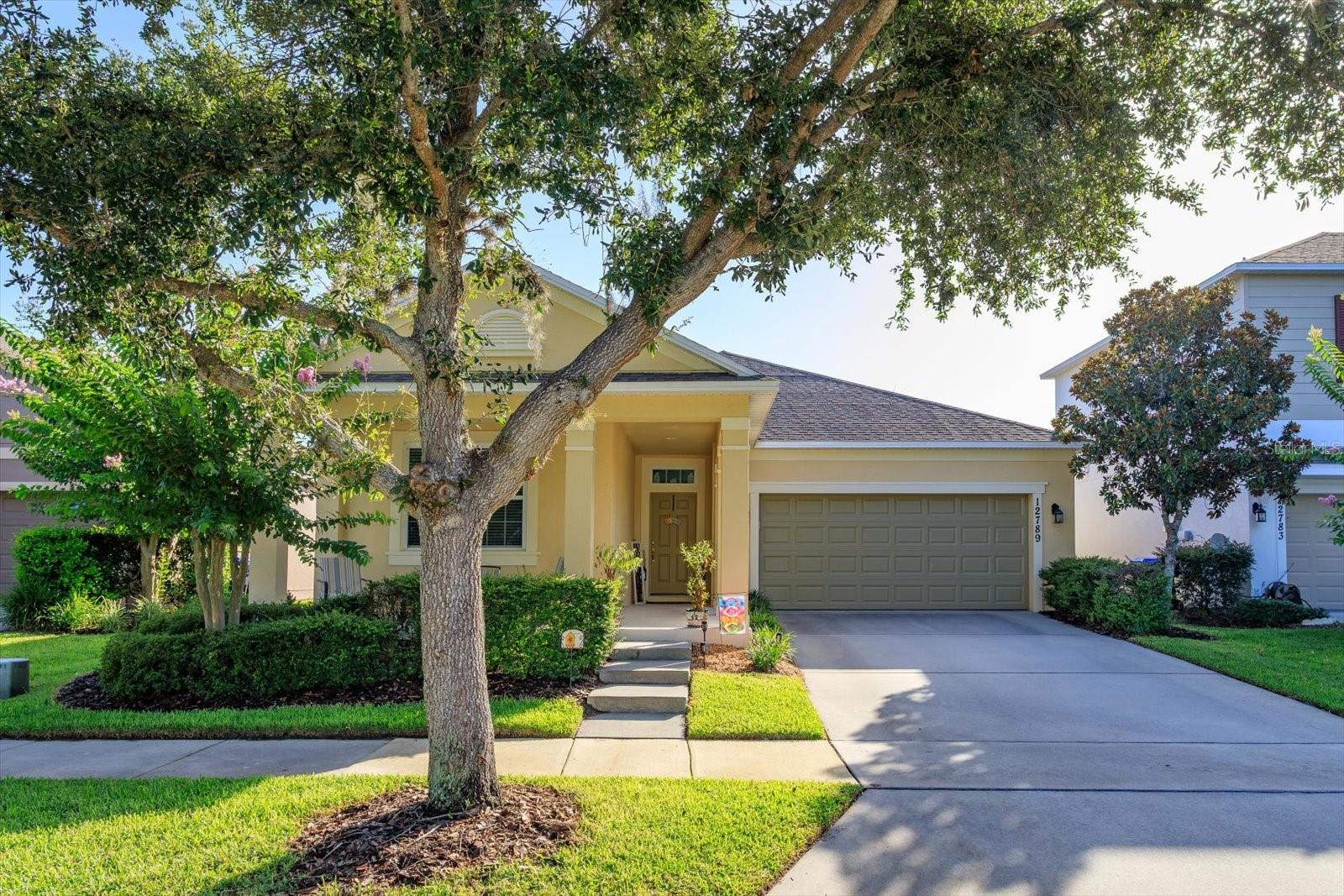 This stunning Ashton Woods home in the highly sought-after Wickham Park community of Windermere truly shows like a model. Built in 2012, this beautifully maintained single-story home offers 3 bedrooms, 2 bathrooms, and a 2-car garage. The bright, open-concept floor plan features laminate flooring and is perfect for both everyday living and entertaining. The chef’s kitchen boasts granite countertops, 42-inch cabinetry, stainless steel appliances, a custom tile backsplash, stylish pendant lighting, and a large center island with plenty of prep space and seating. The spacious owner’s retreat offers elegant tray ceiling with crown molding, walk-in closet, a soaking garden tub, and a separate walk-in shower.      Updates include a newer A/C system (approximately 2½ years old), range & refrigerator (3 yrs old), exterior paint completed in 2023, and a roof replacement scheduled by the HOA in an upcoming phase.     The backyard is your own private oasis.  It's fully enclosed with vinyl privacy fencing, and enhanced with mature landscaping and accent lighting, creating a peaceful retreat for relaxing or entertaining, and making lasting memories. The resort-style saltwater pool, built in 2016, features a beautiful pebble finish and is surrounded by an expansive paver deck.    From the front yard you can watch Disney’s fireworks every evening from your own driveway.  Or take an after dinner stroll around the walking trail surrounding the lake across the street.     Enjoy a truly low-maintenance lifestyle with HOA dues that include lawn care, shrub maintenance, fertilization, pest control, mulching, termite bond coverage, exterior painting, and roof replacement.      Residents also enjoy access to Wickham Park’s community pool, clubhouse, gazebo, and open green spaces.  
Ideally located just minutes from Walt Disney World,  Disney Spring, Universal Orlando, Winter Garden Village, Lakeside Village, and Westside shopping and dining destinations, this home is also zoned for highly rated schools. This move-in-ready home offers the perfect blend of luxury, convenience, and carefree Florida living. **Schedule your private showing today!**