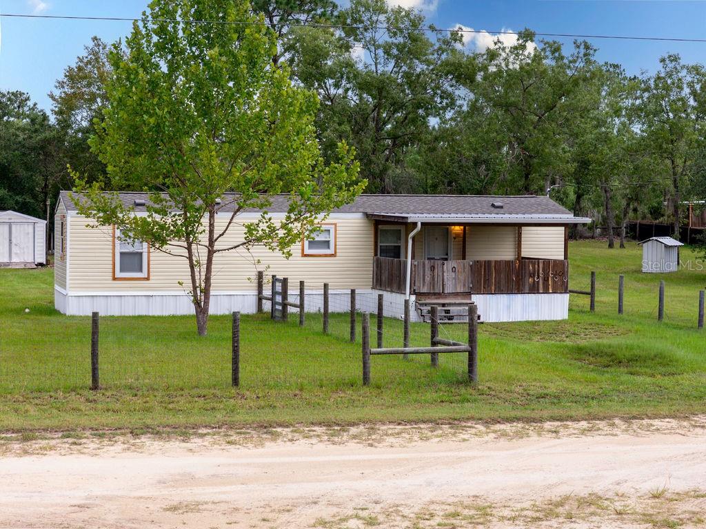 Move-in ready and beautifully renovated, this charming 2-bedroom, 1-bath home offers comfortable country living on 1.25 fully fenced acres. The property features approximately 780 square feet of living space and 1,080 total square feet, including inviting covered front and rear porches.

Inside, the bright, open layout creates a comfortable flow between the living area and kitchen. The updated kitchen features soft-close cabinetry, stainless-steel appliances installed in May 2024, and a convenient breakfast bar that provides additional seating and workspace. Luxury vinyl plank flooring extends throughout the main living areas, while both bedrooms feature newer carpeting. The renovated bathroom, updated interior doors, ceiling fans, light fixtures, window blinds, and neutral finishes complete the refreshed interior.

Many of the home’s major components have already been updated, including a new roof and 2-ton HVAC system installed in March 2024 and energy-efficient windows installed in 2025. Gutters have also been added for additional exterior protection.

Enjoy peaceful mornings on the covered front porch or relax and entertain on the spacious, screened-in back porch. The rear porch features a pan roof that also helps protect the back entrance and HVAC equipment. Outside, the fenced property provides ample usable space and includes a metal storage shed equipped with electricity.

Situated in a quiet rural setting, this thoughtfully updated property combines privacy, acreage, storage, and numerous major improvements—all ready for its next owner.