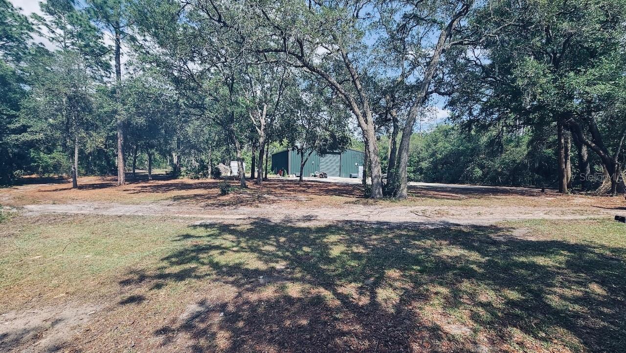 RARE OPPORTUNITIES DO EXIST - so hurry to see if THIS PROPERTY may be the PERFECT FIT FOR YOU!! This is a wonderfully situated, 2 and a half acre parcel that includes a 3/2 MOBILE HOME, a massive 45X60 RED IRON Metal Building, a SECONDARY LIVING QUARTERS and a BUNKER SHELTER ROOM! Take a Tour Today so that you can personally envision the endless possibilities here at 5275 SW 183RD TER in Dunnellon. Seeking Cash Offers. Get your Penny's Worth from Today's Real Estate Market Before Someone Else does!