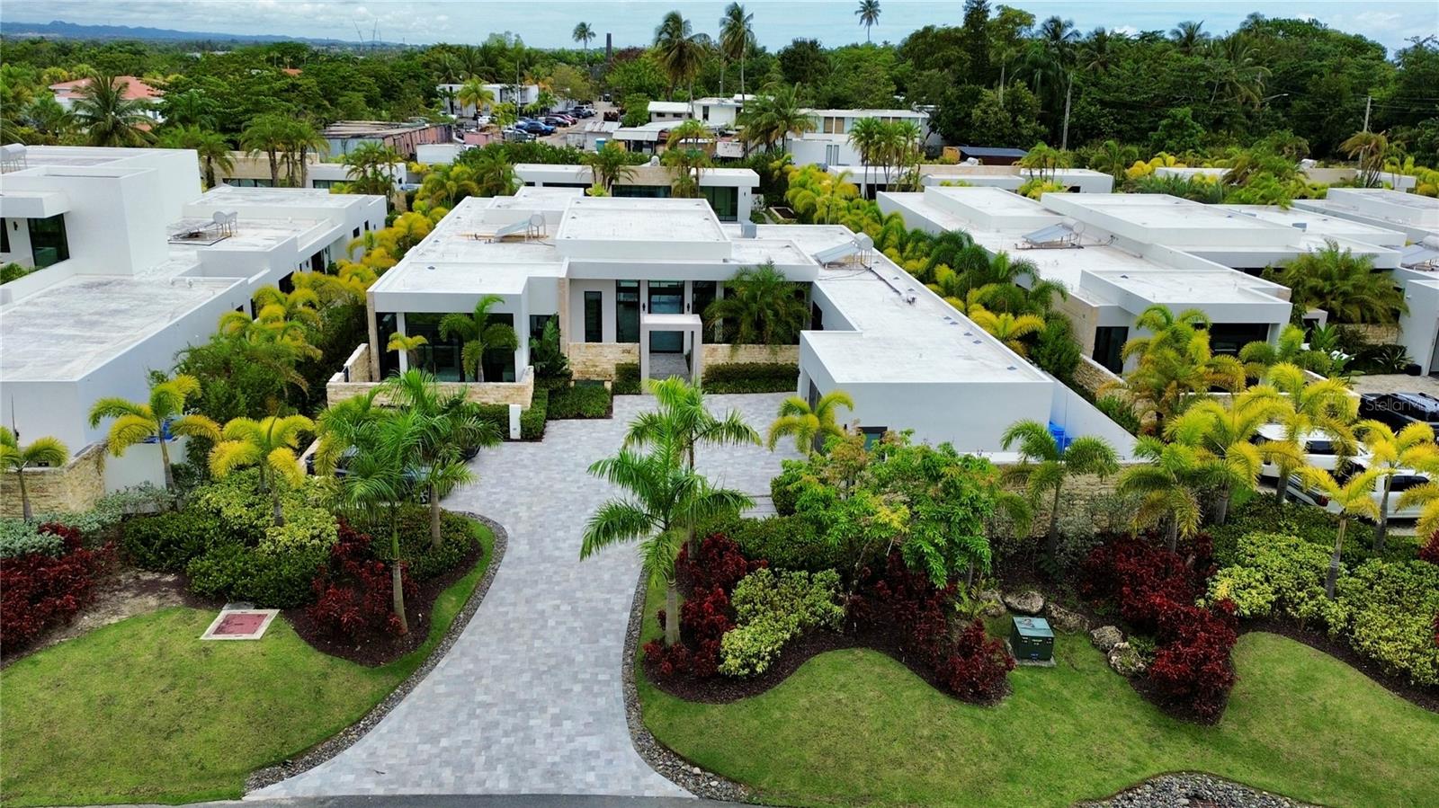 A one-of-a-kind gem in the market, 202 Legacy sets the standard for modern luxury and offers an unmatched level of refinement and style.

Located in the prestigious Dorado Beach East community, this exceptional estate features 8,881 sq. ft. of total construction, including 8,538.34 sq. ft. of interior space and a 342.66 sq. ft. terrace. Behind the main home, a detached casita offers 1,467 sq. ft. of air-conditioned space and a 290 sq. ft. covered, non-conditioned area.

This stunning property sits on a massive 2,398.49 sq. m. lot, providing the ultimate in privacy, comfort, and space. The main residence showcases the highest peak of luxury, boasting top-of-the-line modern features and finishes throughout. 

With its clean, contemporary design and practically new condition, this home offers the perfect blend of sophisticated living and everyday convenience. The expansive layout includes a state-of-the-art kitchen, spacious living and dining areas, and multiple outdoor living spaces that seamlessly flow into each other, perfect for entertaining. 

The focal point of the property is the magnificent elongated heated pool, with the detached casita situated to face its beauty. The casita itself is a serene retreat, featuring a private bedroom and full bath, as well as a cozy living room, full kitchen, complete gym, and a pool bathroom with an outdoor shower.

Enjoy exclusive community access to Dorado Beach East's world-class amenities, including golf courses, beaches, and fine dining. This is truly a home that redefines luxury living.

Don't miss your chance to own one of the most sought-after properties in Dorado. Schedule your private showing today and experience the elegance and grandeur of 202 Legacy.
