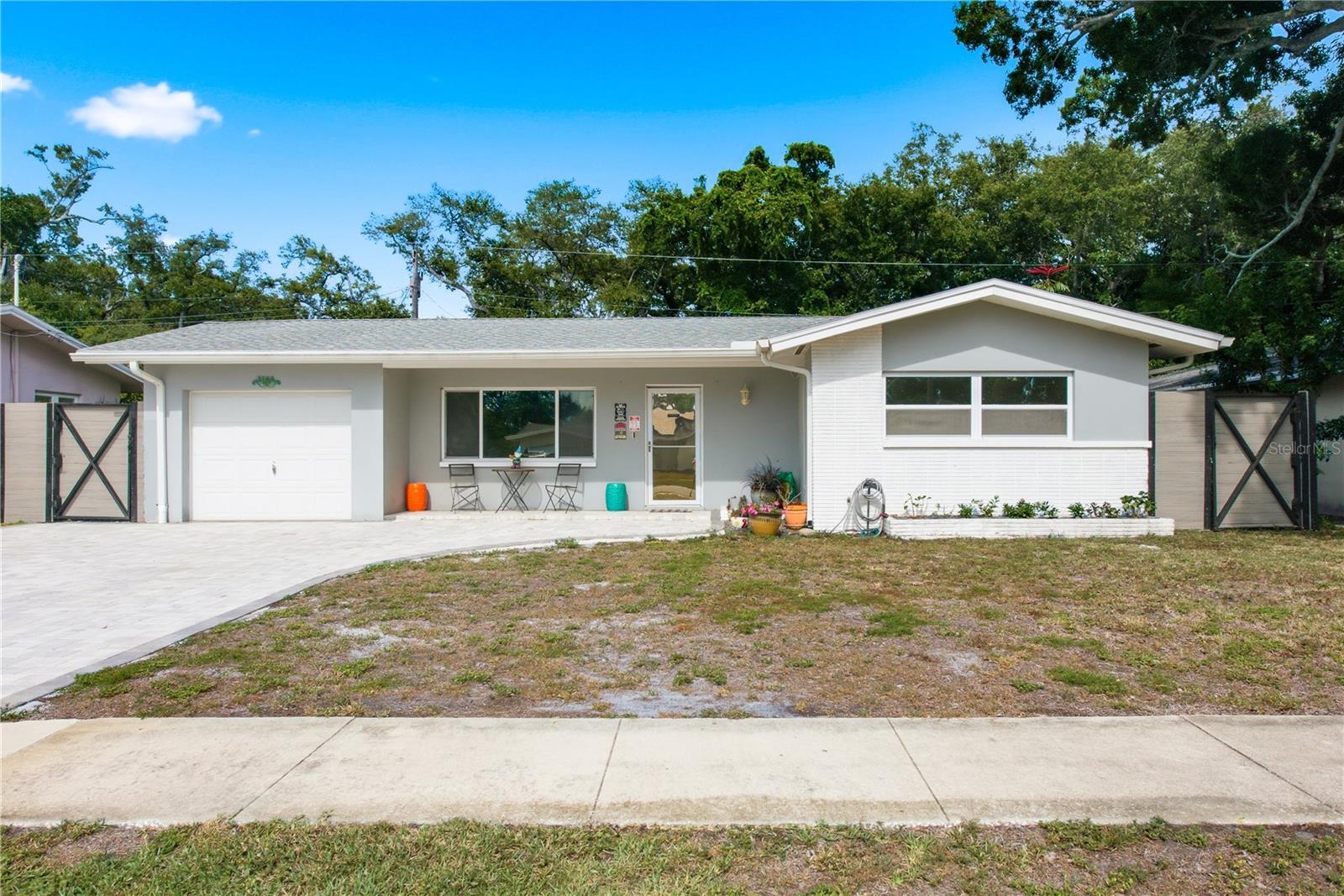 Welcome to 1144 Woodbrook Drive, a beautifully renovated 3-bedroom, 2-bathroom residence nestled in the heart of Largo. This stunning home offers a thoughtfully designed open layout with a desirable split floor plan, providing both flow and privacy. Showcasing a modern interior aesthetic, the home exudes warmth and character with stylish finishes throughout. Recent upgrades ensure peace of mind, including a brand-new HVAC system (2024), an oversized driveway (2023), and a newer roof (2021). Outdoors, enjoy the Florida lifestyle with a sparkling above-ground pool, a low-maintenance turf yard, and ample space for hobbies or storage with a large workshop and additional shed. The oversized driveway provides generous parking for multiple vehicles or recreational equipment. This home is a perfect blend of comfort, style, and functionality—offering the ideal setting for everyday living and entertaining.