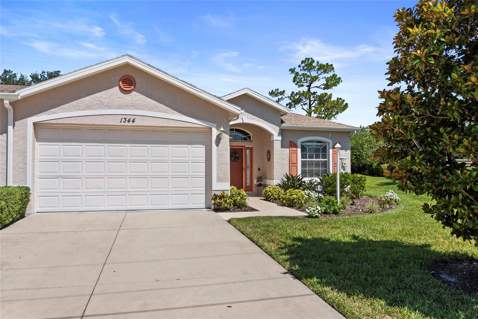 Welcome to effortless Florida living in the Woodhaven Estates community. This beautifully maintained 3-bedroom, 2-bath villa offers a spacious, light-filled floor plan designed for both comfortable everyday living and easy entertaining.

Vaulted ceilings and abundant natural light create an open, airy feel throughout the main living areas, while the kitchen overlooks the living and dining spaces, keeping everyone connected. The split-bedroom layout provides privacy for both owners and guests, and the spacious primary suite serves as a relaxing retreat.

Enjoy peace of mind with a new roof installed in 2022 and A/C replaced in 2018. The attached two-car garage, interior laundry room, and low-maintenance lifestyle make this home ideal for year-round residents, seasonal owners, or anyone looking to spend less time on upkeep and more time enjoying Florida.

Step outside to your screened lanai, the perfect place to enjoy morning coffee, or simply relax with views of the beautifully maintained surroundings.

Residents of Woodhaven Estates enjoy access to a community clubhouse and swimming pool, creating opportunities to socialize, stay active, and enjoy the Florida sunshine year-round.

Conveniently located near shopping, dining, golf courses, medical facilities, and everyday conveniences, this move-in ready villa offers the perfect combination of comfort, convenience, and community.

Whether you're looking for a seasonal escape or your next full-time residence, this Woodhaven Estates villa is ready to welcome you home.