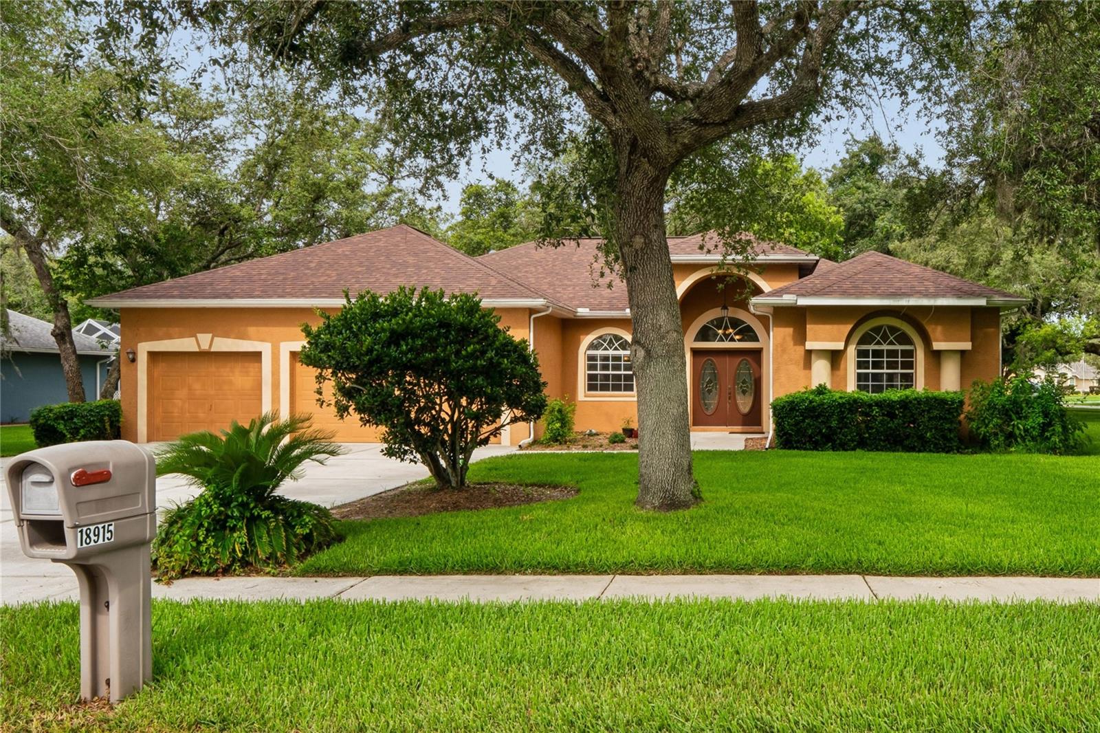 AN AUTUMN OAKS BEAUTY!
Nestled on a spacious ½-acre lot (.65) in the upscale community of Autumn Oaks, this well-maintained 3-bedroom, 2-bath, 3-car garage home offers peace of mind with major updates already completed: brand new roof, A/C (2017), and water heater (2017).

Step inside to formal living and dining rooms, perfect for entertaining, featuring glass sliders that lead to the backyard porch. The open, eat-in kitchen boasts abundant cabinetry, a large pantry, center island with electric, and a counter-height breakfast bar—all overlooking the inviting family room.

The split-bedroom floor plan provides privacy, with a spacious primary suite featuring dual vanities, a jetted garden tub, separate shower, and private water closet. Bedrooms two and three have ample closet space and share a well-appointed hall bath.

Additional highlights include an inside laundry room with washer and dryer included, and a generous 3-car garage with a side entry door—perfect for vehicles, storage, or all your outdoor toys. Screened enclosed back porch opens to an enormous open porch for BBQs, spa or play space. 

Enjoy the space, comfort, and functionality this beautiful home has to offer! Located in the scenic Autumn Oaks subdivision where each home sits on at least half an acre, this community offers low HOA fees and a wide array of amenities: tennis, pickleball, bocce and basketball courts, playground, picnic and grilling areas, restrooms, and community sidewalks with street lighting. Conveniently situated on the Pasco/Hernando County line, you’ll enjoy quick access to US 19, the Suncoast Parkway, major shopping centers, restaurants, Tampa and Tampa International Airport.