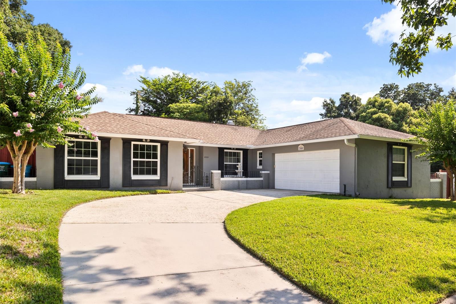 Beautifully updated 4-bedroom, 2-bath split-plan home offering approximately 2,280 square feet of living space, ideally situated on a quiet cul-de-sac in desirable Maitland. This well-maintained residence is zoned for highly sought-after Dommerich Elementary, Maitland Middle, and Winter Park High School.

The spacious floor plan features oversized rooms throughout, including formal living and dining areas, a large family room with a decorative stone accent wall and cozy fireplace, and a generous eat-in kitchen with granite countertops, updated cabinetry, and breakfast area. French doors provide abundant natural light and open to the screened patio and outdoor living spaces.

Major improvements including updated flooring, fresh interior paint, double-pane windows, blown attic insulation, all-new ductwork, updated plumbing, a new electrical breaker panel, and complete home rewiring. Crown molding, recessed lighting, six-inch baseboards, and French doors add style and functionality throughout the home.

The primary suite features French doors to the patio, a walk-in closet, dressing area, and a beautifully renovated bath with dual vanities, walk-in shower, travertine finishes, and updated fixtures. The secondary bathroom has also been fully remodeled with marble finishes, dual vanities, a new tub, and updated lighting.

Outdoor highlights include a large rear deck, brick patio area, irrigation well and sprinkler system, and a fully fenced backyard with separate sections—ideal for pets, play, and entertaining. The perimeter fence was replaced and stained in 2017.

Move-in ready and thoughtfully updated throughout, this exceptional home combines classic character, quality improvements, and an unbeatable location close to top-rated schools, parks, shopping, and dining.