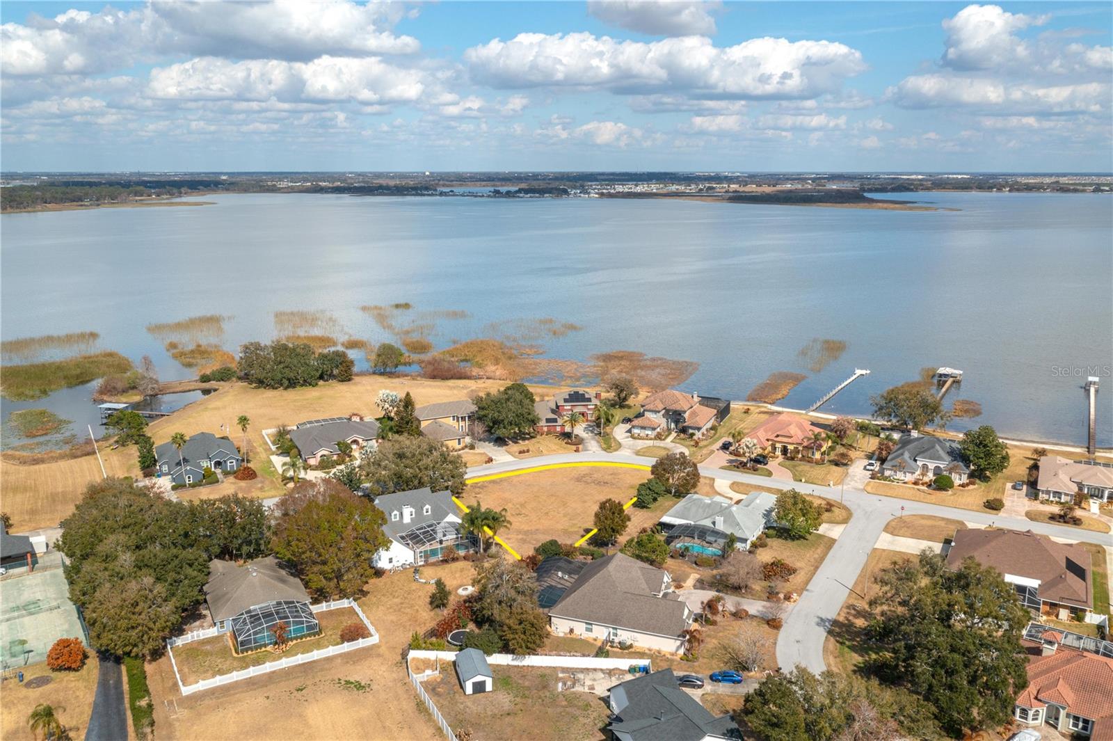 FABULOUS HOME SITE on nearly a half an acre, situated in a beautiful neighborhood among custom built homes! This large lot is across the street from lakefront homes on Lake Hamilton. This beautiful building lot is a rare find that you don't want to miss, it is a perfect location to enjoy golfing and amenities offered at the Country Club of Winter Haven. Convenient to US Hwy 27 and just 10 minutes to downtown Winter Haven.