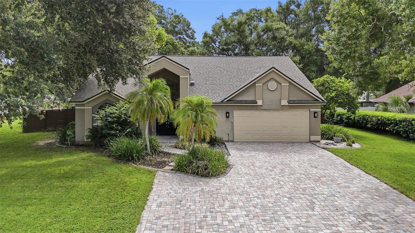 Virtually Staged. Move-in ready 4-bedroom, 3-bath pool home on a private 1/3-acre lot with a NEW A/C (2024), roof replaced in 2022, and LOW HOA fees of just $300/year!

This well-maintained home features vaulted ceilings, a desirable first-floor primary suite, and an upstairs loft/bonus room that offers flexible space for a game room, home office, or media room.

The spacious kitchen is equipped with white shaker-style cabinets, stainless steel appliances, recessed lighting, a coffee bar, and abundant counter space. Open to the family room with vaulted ceilings and a wood-burning fireplace, the layout is ideal for everyday living and entertaining.

The primary suite is privately located on the first floor and includes a walk-in closet, dual vanities, a soaking garden tub, and a newly remodeled walk-in shower. The secondary bedrooms are generously sized with large closets and ceiling fans, and the secondary bathroom has also been updated.

Step outside to enjoy Florida living with a fully enclosed lanai, sparkling pool, outdoor kitchen, and expansive deck overlooking the fully fenced backyard. With no backyard neighbors, mature shade trees, and a storage shed, this property offers both privacy and functionality.

Additional features include an extended driveway, garage with side entry door and extra storage space, and a fully fenced backyard.

Conveniently located near shopping, dining, parks, major highways, downtown Tampa, and MacDill Air Force Base.