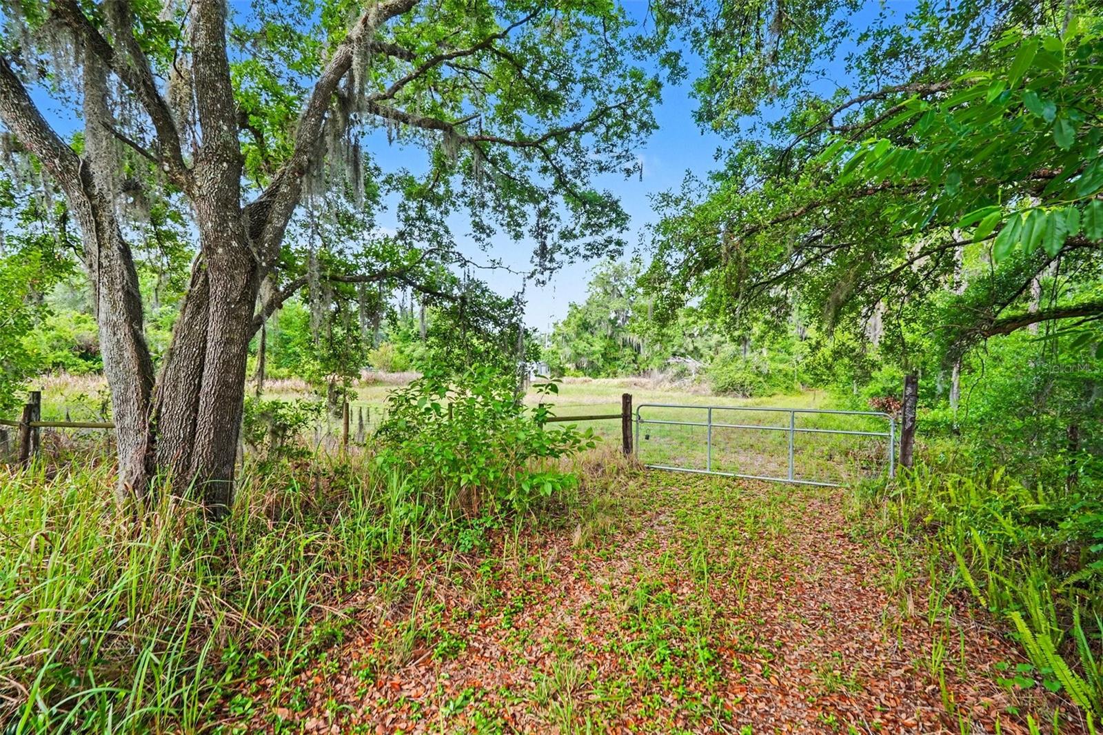 MAJOR VALUE: TWO IMPROVED HOMESITES WITH THOUSANDS OF DOLLARS IN POTENTIAL DEVELOPMENT SAVINGS

Unlike raw land, two of the three parcels already have existing wells, septic systems, and electrical service in place. When you factor in the cost of impact fees, installing new wells and septic systems, bringing in electrical service, permitting, site preparation, and the time required to complete those improvements, buyers will save tens of thousands of dollars and a substantial amount of time. 

This existing infrastructure is a major advantage, allowing buyers to save both time and money while accelerating the development process.

An added bonus: this property is NOT located in a flood zone, providing added peace of mind, lower potential flood insurance costs, and greater flexibility for future development.

This is a Rare opportunity to own 7.55 acres in fast-growing Plant City with three separate legal parcels being sold together for one price. Zoned AS-1 (approximately one home per acre), this property offers exceptional flexibility for a builder, developer, investor, family compound, equestrian property, or anyone looking for space, privacy, and future potential.

The Property Includes:

• 4103 Stanley Rd – 1.08 acres featuring an existing well, septic system, and electrical service already in place, creating immediate value while reducing future development costs. This parcel is fenced, offers paved road frontage, and includes the established entrance easement (approximately 50 feet wide by 585 feet long) providing access to the additional parcels.

• Center Parcel – 5.47 acres of mostly open pasture ready for your vision. Approximately 1.08 acres toward the rear may be considered low-lying or wetland area (buyer to verify). Zoned AS-1 with the potential for up to five homesites (buyer to verify), making it an outstanding opportunity for future development, a private estate, or a multi-home family compound.

• 4107 Stanley Rd – Additional 1-acre parcel featuring an older mobile home with an existing well, septic system, and electrical service already in place, providing another improved homesite with added value for renovation, replacement, or future construction.

Whether you’re looking to build multiple homes, create a private family estate, develop an investment project, or simply enjoy country living with room to grow, this property offers endless possibilities.

No HOA. Not located in a flood zone. Bring your boats, RVs, trailers, animals, workshops, and all your toys without HOA restrictions.

Conveniently located just minutes from I-4, you’ll enjoy quick access to both Tampa and Orlando while still experiencing the privacy and charm of rural Plant City.

Properties offering three legal parcels, two improved homesites with existing utilities, development potential, and this level of flexibility are becoming increasingly difficult to find. Don’t miss this unique opportunity.

Buyer to verify zoning, density, buildability, wetlands, easements, impact fees, and all county requirements.