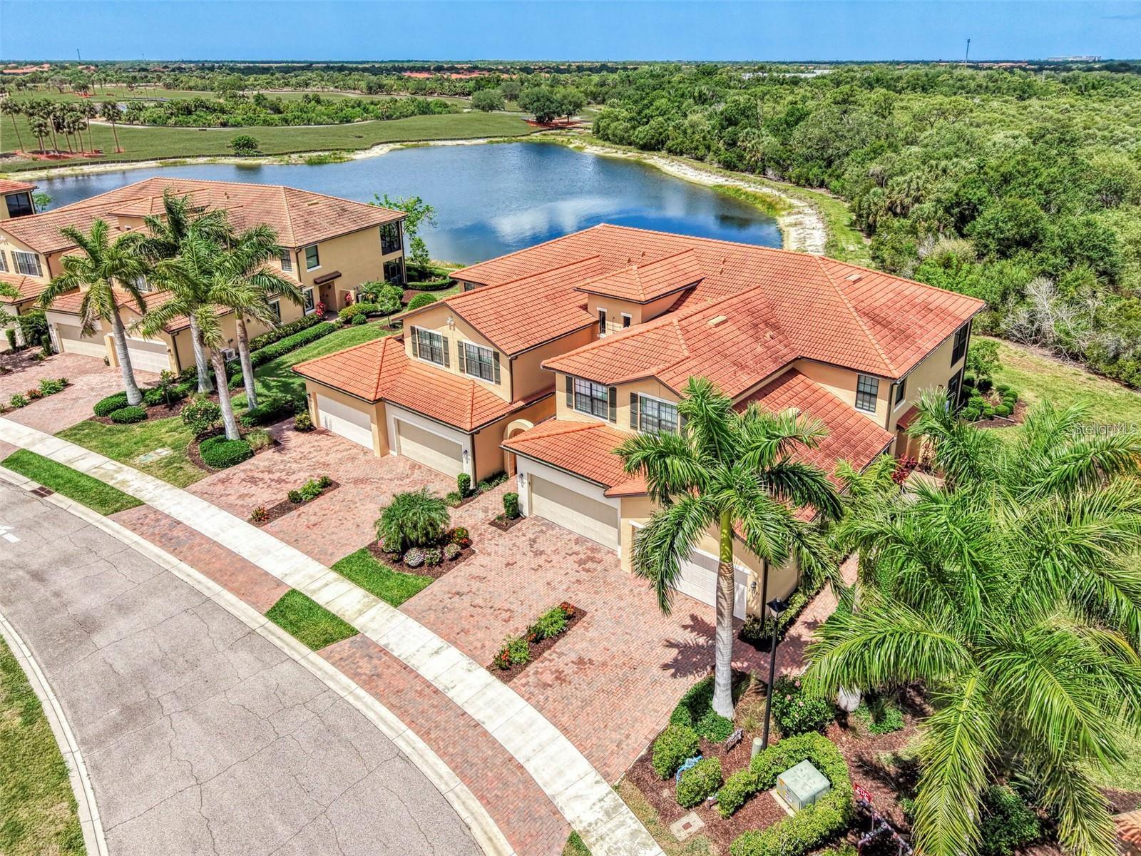 Welcome to a "Golfer's Paradise" in the highly sought-after gated resort community of Sarasota National. This beautifully appointed three-bedroom, two-bath coach home is elegantly "Turnkey Furnished" and perfectly positioned to capture a stunning preserve, water and golf course views. Designed for effortless Florida living. This spacious residence offers comfort, style and an exceptional resort lifestyle all in one. Step through the elegant, beveled glass entry door into a beautifully designed home where timeless architecture meets modern comfort. An inviting dining room with graceful arched details sets the tone, flowing seamlessly into a spacious living room ideal for everyday living and entertaining. The thoughtfully designed kitchen is the heart of the home, featuring quartz countertops, subway tile backsplash and stainless steel appliances. The desirable split-bedroom offers added privacy and flexibility, making it perfect for hosting guests or creating a comfortable retreat for everyone in the household. Relax on your private lanai while enjoying peaceful panoramic scenery and breathtaking sunsets. Residents of Sarasota National enjoy world-class amenities including: Three restaurants and fine dining, Coffee shop with Wi-Fi, Resort style heated pool and spa, Complete fitness center with two dedicated exercise and yoga studios, Pickleball and tennis courts, Bocce ball courts, Two dog parks and children's playground, Pro shop, plus two golf memberships are included for the championship golf course designed by Gordon B. Lewis. Whether you are seeking a seasonal retreat, full-time residence, or investment opportunity, this exceptional home offers luxury resort living at its finest. Experience the ultimate Florida golf and lifestyle community--where every day feels like a vacation.