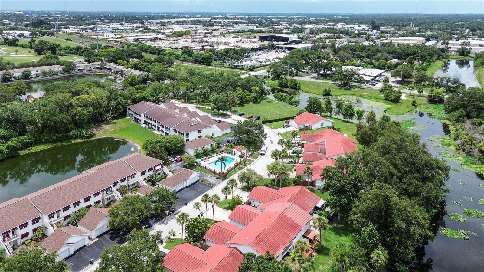 Rarely available and completely remodeled, this stunning SINGLE-STORY, corner-unit villa offers the perfect blend of privacy, modern updates, and peaceful pond views. Conveniently located directly across from the community pool! Featuring 2 spacious bedrooms, 2 full bathrooms, a one-car garage, and an indoor laundry room, this move-in-ready home is truly one of a kind. Step inside to discover fresh interior paint and trim, beautiful luxury vinyl plank flooring throughout, and a thoughtfully redesigned open living space. The gorgeous chef’s kitchen is the centerpiece of the home, showcasing solid wood cabinetry, sleek quartz countertops, and brand-new stainless steel appliances—perfect for both everyday living and entertaining. Both bathrooms have been beautifully renovated with designer tile showers, stylish new vanities, updated lighting, and modern finishes. Each generously sized bedroom offers the comfort of its own private en-suite bathroom and spacious walk-in closet, creating the ideal layout for guests, roommates, or multi-generational living. Outside, you’ll enjoy exceptional indoor-outdoor living with over 300 square feet of private front terrace space, fully enclosed for added privacy and perfect for entertaining, grilling, or simply relaxing. Out back, unwind on the screened-in porch overlooking the tranquil pond, complete with a brand-new wood deck—the perfect spot to enjoy your morning coffee or take in Florida’s breathtaking sunsets. Additional highlights include a new A/C installed in 2025, all new Energy efficient windows and doors, abundant storage throughout, an attached garage, and the convenience of an indoor laundry room. Combining rare single-story living, premium updates, and serene waterfront views, this exceptional villa is ready for its next owner to call it home.