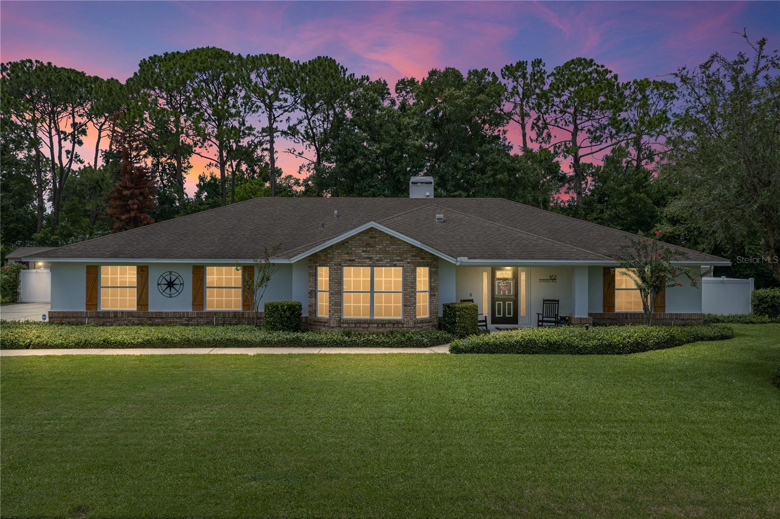 Welcome to 162 Old Nichols Circle, Auburndale, FL 33823, a beautifully updated pool home that has undergone an impressive transformation inside and out. The meticulously maintained interior features an open, split-bedroom floor plan with wood-look plank tile flooring throughout, vaulted ceilings, abundant recessed lighting, ceiling fans and a warm wood-burning fireplace anchoring the spacious living and dining areas. The expansive kitchen is designed for both everyday living and entertaining, offering granite countertops, white cabinetry, stainless-steel appliances, generous workspace, and an exceptional walk-in pantry with custom shelving. The private primary suite includes a custom-designed walk-in closet and a beautifully updated bathroom featuring dual vanities with granite countertops and an oversized tiled walk-in shower. Additional highlights include a versatile office or flex room, interior laundry area, ample storage, tinted windows that provide added privacy and energy efficiency. a two-car garage and an expansive driveway providing plenty of additional parking. French doors open to an outstanding outdoor living area with a large covered patio, tongue-and-groove wood-plank ceiling, multiple seating and dining areas and a custom bar overlooking the screened swimming pool. A spacious paver patio surrounds the pool and extends the entertaining space into the large, fully fenced backyard, complete with a play area and a substantial detached storage building ideal for lawn equipment, tools and recreational gear. The home is situated in a charming, well-maintained community of only approximately 36 homes, known for its spacious lots, low HOA fees and visible pride of ownership. Residents also enjoy access to a private community boat launch on beautiful Lake Arietta, creating opportunities for boating, fishing and enjoying the Florida lifestyle. This exceptional property combines a thoughtfully updated interior, resort-style outdoor living, generous storage and desirable community amenities in one remarkable home.