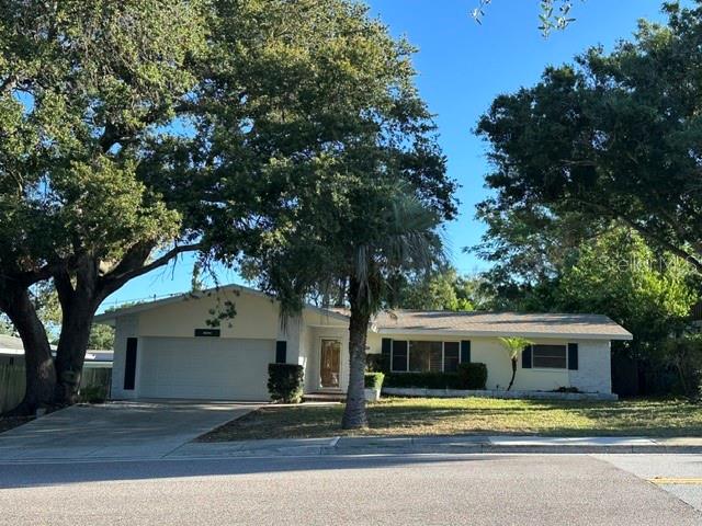 OPPORTUNITY AWAITS! THIS 3-BEDROOM, 2-BATH HOME WITH 2-CAR GARAGE OFFERS ENDLESS POTENTIAL FOR INVESTORS, CONTRACTORS, FLIPPERS, OR BUYERS LOOKING TO CREATE THEIR DREAM HOME. FEATURING CLASSIC TERRAZZO FLOORING THROUGHOUT, A SPACIOUS ENCLOSED PORCH, A LARGE FENCED BACKYARD, THIS PROPERTY PROVIDES A SOLID FOUNDATION FOR RENOVATION AND VALUE-ADD IMPROVEMENTS. MAJOR UPDATES INCLUDE A/C SYSTEM APPROX. 14 MONTHS OLD AND A ROOF THAT IS ONLY 7 YEARS OLD, HELPING TO REDUCE FUTURE MAINTENANCE CONCERNS. FRESH INTERIOR & EXTERIOR PAINT GIVE THE HOME A CLEAN REFRESHED APPEARANCE WHILE LEAVING PLENTY OF ROOM FOR CUSTOMIZATION. IDEALLY LOCATED JUST MINUTES FROM THE CLEARWATER COUNTRY CLUB, SHOPPING, DINING, PARKS, AND BEAUTIFUL GULF BEACHES, THIS PROPERTY COMBINES LOCATION, POTENTIAL, AND OPPORTUNITY. WETHER YOUR'RE LOOKING FOR YOUR NEXT INVESTMENT PROJECT OR A HOME WITH ROOM TO MAKE IT YOUR OWN, THIS CLEARWATER GEM IS WORTH A LOOK!