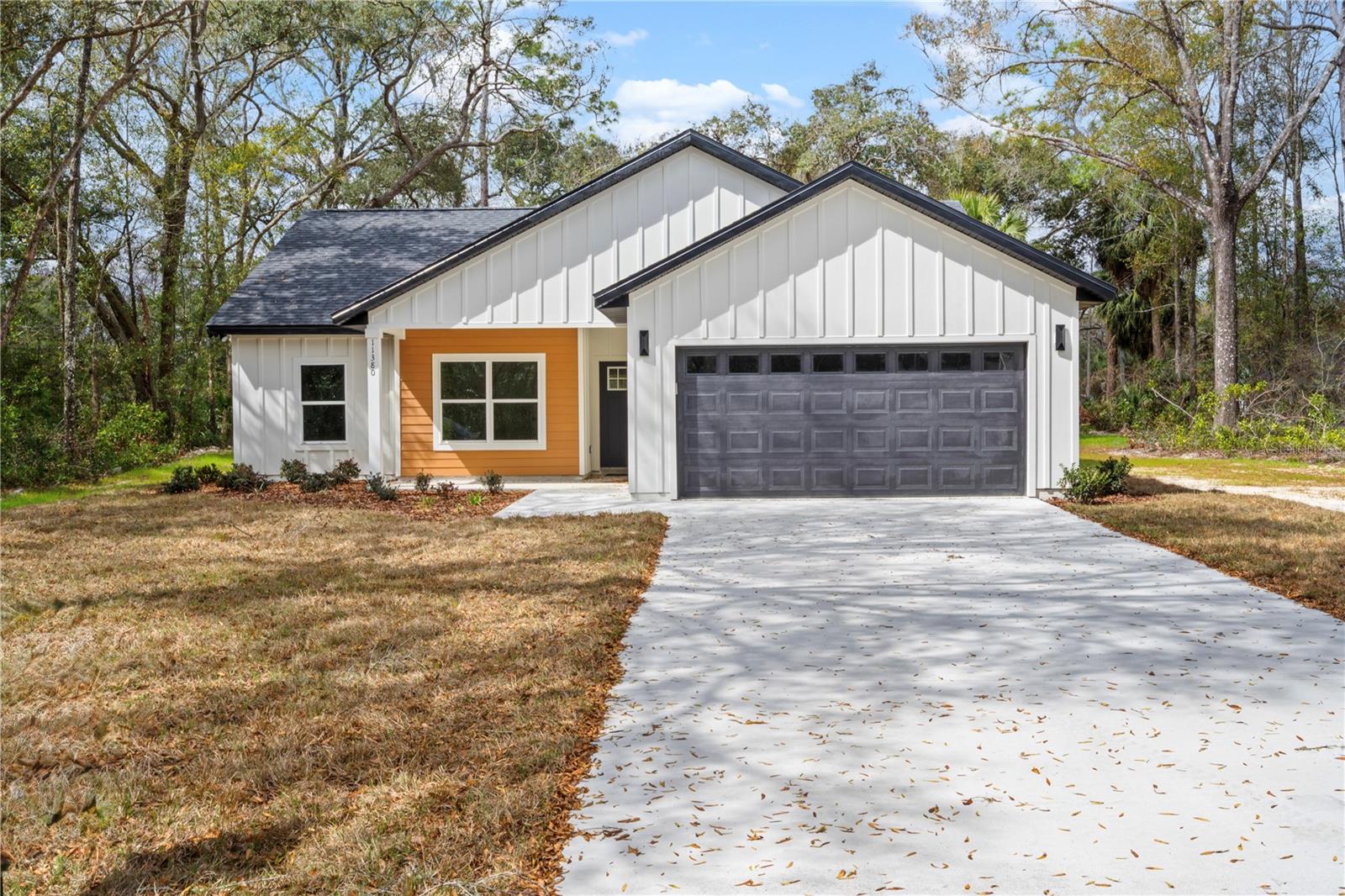 Eligible for 100% financing!! Brand New Home in Golf Course Community with no HOA fees!! Don’t miss this stunning new 3 bedroom, 2 bath boasting features of a custom home sitting on a spacious .53 acre corner lot in Chiefland Country Estates. Designed for country living with modern touches, this home features 9-foot ceilings, modern fireplace, luxury vinyl plank flooring, and quartz countertops throughout. The stylish kitchen includes a large island, apron sink, pot filler, quartz backsplash, pantry, decorative lighting, and stainless steel appliances (refrigerator, electric range, microwave hood, garbage disposal, and dishwasher all included). The open floor plan flows seamlessly to a covered front porch and covered back patio, perfect for relaxing or entertaining. The spacious primary suite offers a walk-in closet, double vanities, free standing tub, beautifully tiled curb-less shower with linear drain, and access to lanai. Enjoy added convenience with an indoor laundry room with linen closet, built in mud area, and an oversized 2-car garage. Located just 5 minutes from Manatee Springs State Park and the public boat ramp at Clay Landing on the Suwannee River, outdoor adventure is right at your doorstep. Don't miss out on your slice of paradise!