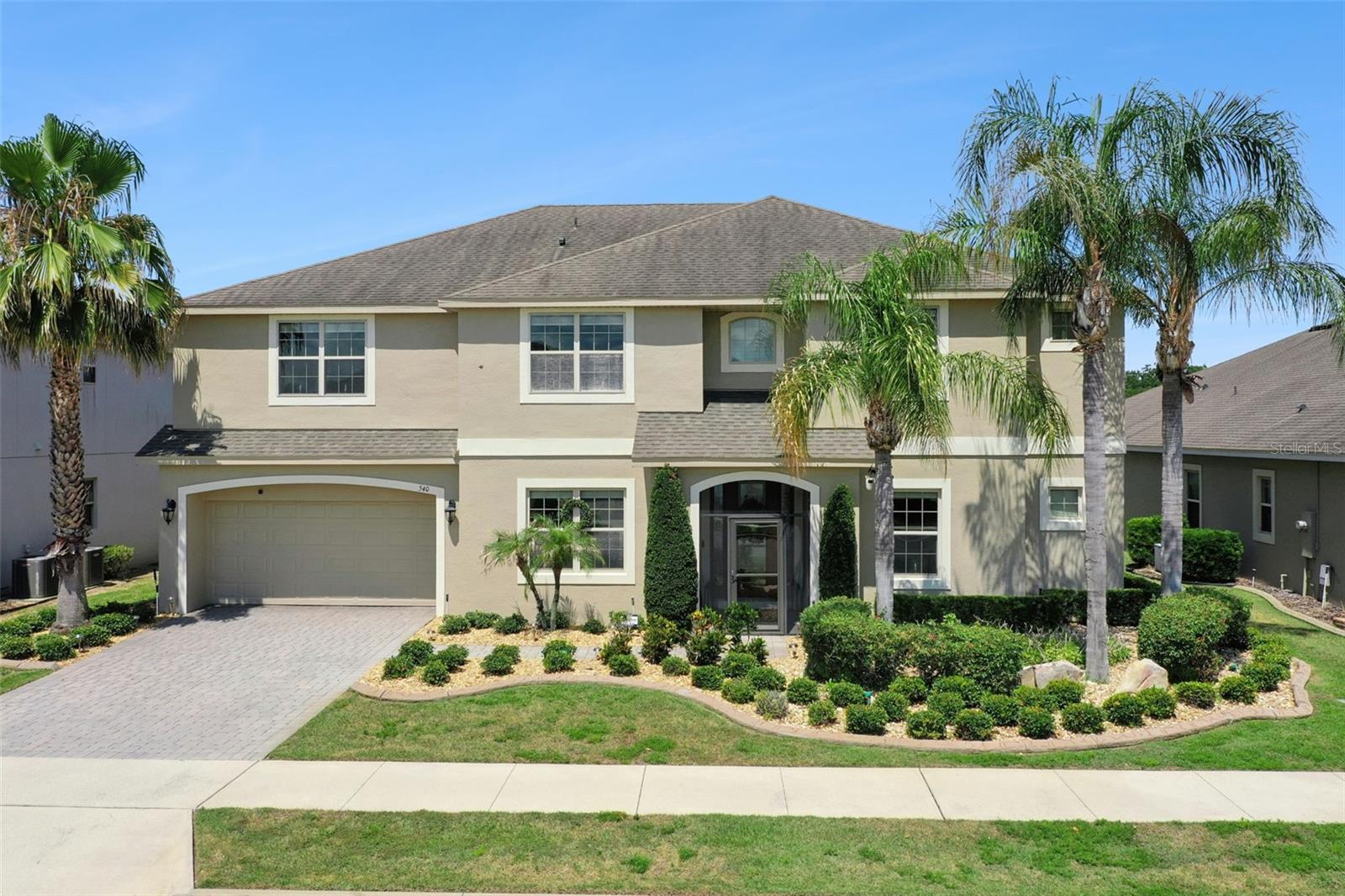 Welcome to luxury living inside the highly sought-after Highland Ranch community! Built by renowned Taylor Morrison, this exceptional 6-bedroom, 5.5-bathroom estate combines elegance, functionality, and resort-style outdoor living on a private pond-view homesite with no rear neighbors.
From the moment you arrive, you’ll appreciate the impressive curb appeal, tandem garage, and custom screened front entry that creates a grand first impression while allowing for beautiful cross breezes throughout the home. Meticulously maintained and lightly lived in, this home showcases true pride of ownership with the A/C serviced every six months and every detail immaculately cared for.
Inside, the home features soaring ceilings, 8-foot doors, crown molding throughout, elegant tray ceilings, and a stunning open-to-second-floor foyer and great room filled with natural light. The expansive first-floor primary suite offers peaceful water views and features a luxurious spa-inspired bathroom with separate vanities, oversized walk-in shower, garden tub, and dual walk-in closets.
The thoughtfully designed floor plan includes a private office at the front of the home, formal dining room, and a convenient walk-through butler’s pantry leading into the gourmet chef’s kitchen. Designed for entertaining, the kitchen is equipped with a gas cooktop, vented hood, built-in wall oven and microwave, built-in pot filler, breakfast area, and double oversized islands providing abundant countertop space, cabinetry, and seating. A spacious first-floor laundry room and full pool bath with exterior access add everyday convenience.
Upstairs, the layout offers incredible flexibility with a large bonus room, spacious secondary bedrooms, and a unique extended hallway design leading to two additional bedrooms connected by a Jack-and-Jill bathroom.
Step outside to your own private backyard oasis featuring a spectacular screened-in pool area complete with a custom-built natural stone waterslide, matching natural stone fire pit, spa, and expansive covered lanai. The resort-style pool, grill, and fire pit are all natural gas heated, creating the perfect year-round entertaining space. The outdoor summer kitchen includes a grill and vented hood, while the newly resurfaced pool decking and lanai along with the freshly painted exterior give the entire outdoor space a fresh, luxurious feel. All of this overlooks a serene pond with total privacy and no rear neighbors.
Residents of Highland Ranch enjoy access to multimillion-dollar community amenities including resort-style pools, clubhouse, fitness center, parks, trails, and more. This is Florida luxury living at its finest!