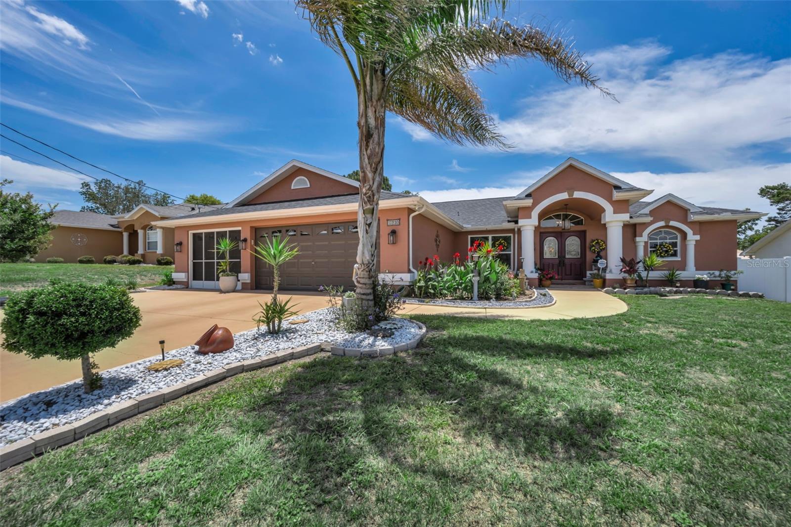 Welcome to this beautifully updated 3-bedroom, 2-bath home with a 3-car garage and no HOA or CDD fees! Offering the perfect blend of luxury, comfort, and functionality, this move-in-ready home features a NEW ROOF (2021), NEW HVAC SYSTEM (2021), NEW WATER HEATER (2023), Windows and Doors replaced (2008), Water Treatment System (2023), Large Screened Back Porch with Pavers (2023), Large Backyard Storage Shed (2023), 6-foot privacy fence (2021), gorgeous tile flooring throughout, and beautifully landscaped grounds featuring a garden, fruit trees, and a banana tree.

Step through the elegant double-door entry into a bright foyer with high ceilings, decorative glass inserts, an arched transom window, and a custom compass rose tile medallion. The open-concept floor plan is ideal for both everyday living and entertaining, featuring a formal dining room with a custom stone accent wall and a beautifully remodeled kitchen with custom cabinetry, pull-out shelving, soft-close drawers, granite countertops, and newer stainless-steel appliances. The home also offers a dedicated laundry room complete with a laundry sink and storage closet for added convenience and organization.

The spacious primary suite features a spa-inspired bath with floor-to-ceiling tile, granite finishes, and an oversized garden tub. Need extra space? The air-conditioned third garage is perfect for a home office, workshop, hobby room, man cave, or she shed.

Enjoy Florida living in your private backyard oasis featuring an oversized lanai, covered gazebo, garden area, fruit trees, detached storage shed, and beautifully landscaped grounds—perfect for relaxing or entertaining. Conveniently located near shopping, dining, parks, schools, and major commuter routes, and just 2 miles from the Hernando County YMCA with its heated pool, fitness and wellness center, classes, events, and activities.

This exceptional home offers modern upgrades, versatile living space, and outstanding value. Schedule your private showing today!