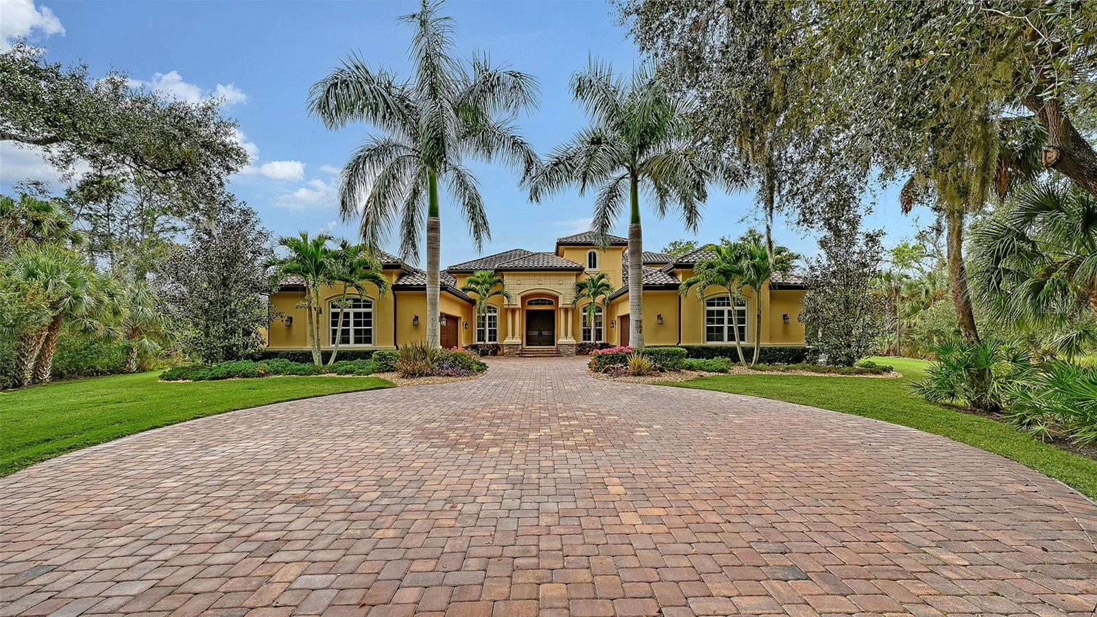 Welcome to 9489 Swaying Branch Road, a beautifully designed residence located within The Forest at Hi Hat Ranch, an exclusive 270-acre gated community comprised of just 54 estate-sized homesites. This intimate Sarasota enclave is defined by its no-repeat architectural rule, ensuring every home is custom built and truly one of a kind. Surrounded by mature landscaping and preserved natural beauty, the community offers a rare balance of luxury, privacy, and tranquility.

This thoughtfully crafted 4-bedroom, 4-bathroom single-family home spans over 4,500 square feet of living space and is ideally positioned on a premium homesite that is over 3 Acres with peaceful lake views from the rear, along with conservation and street views that enhance both privacy and scenery. The open, flexible floor plan is designed for effortless entertaining and everyday comfort, featuring expansive living areas, soaring ceilings, and abundant natural light throughout.

At the heart of the home, the kitchen is designed for both function and gathering, showcasing quality finishes, generous cabinetry, and seamless flow into the main living spaces. Well-appointed bedrooms and bathrooms provide comfort and privacy for family and guests, while additional bonus spaces provide versatility for a home office, media room, or flex living area.

Outdoor living is equally impressive, with a screened pool and spa, covered lanai, and tranquil views that create an ideal setting for year-round enjoyment. Notable upgrades include impact-rated windows for hurricane protection, a whole-home generator for uninterrupted peace of mind, a 4-car garage, irrigation system, and a private setting immersed in nature.

Residents of The Forest at Hi Hat Ranch enjoy a secure, gated lifestyle just minutes from Sarasota’s top-rated schools, shopping, dining, and cultural attractions—while still feeling worlds away from it all.

This is a rare opportunity to own a spacious, custom home in one of Sarasota’s most exclusive low-density communities.