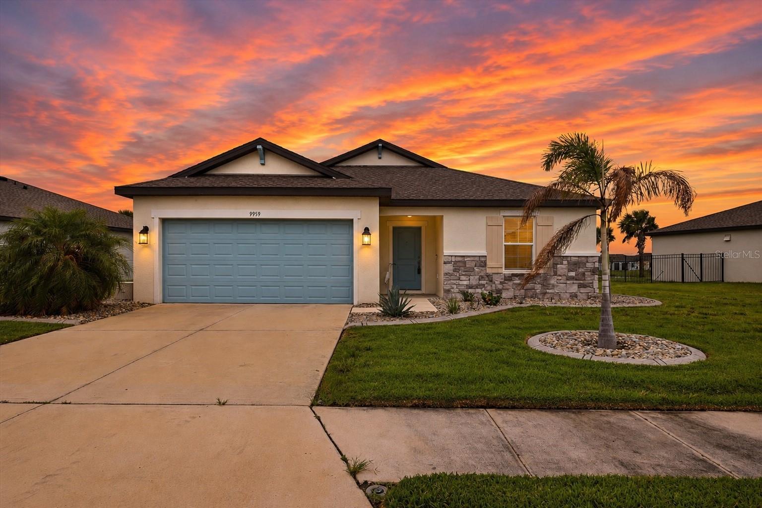 Virtually Staged. Tucked behind a gated-entry on one of the largest lots in the Cove of Summerwoods, this beautifully maintained 2023-built home features 4 bedrooms, 2 bathrooms, and west-facing, stunning lake views. The open-concept kitchen is designed for both style and functionality, offering 42" cabinetry, quartz countertops, stainless steel appliances, bar-style seating and a spacious pantry. The primary suite provides a private retreat with water views, dual vanities, an exceptional oversized walk-in closet, and a well-appointed ensuite bath.  Enjoy peaceful water views from your backyard and the security of a gated community. Residents benefit from a low HOA fee while enjoying exceptional amenities, including a resort-style community pool, family-friendly splash pad, playground, and dog parks. Ideally located near shopping, dining, the brand new BayCare Health Hub, schools, all the conveniences and attractions that Parrish has to provide, and just 2.7 miles from I-75, this home combines modern living, community amenities, and a prime location. Don't miss this opportunity to own a nearly new home in one of the area's most desirable neighborhoods.