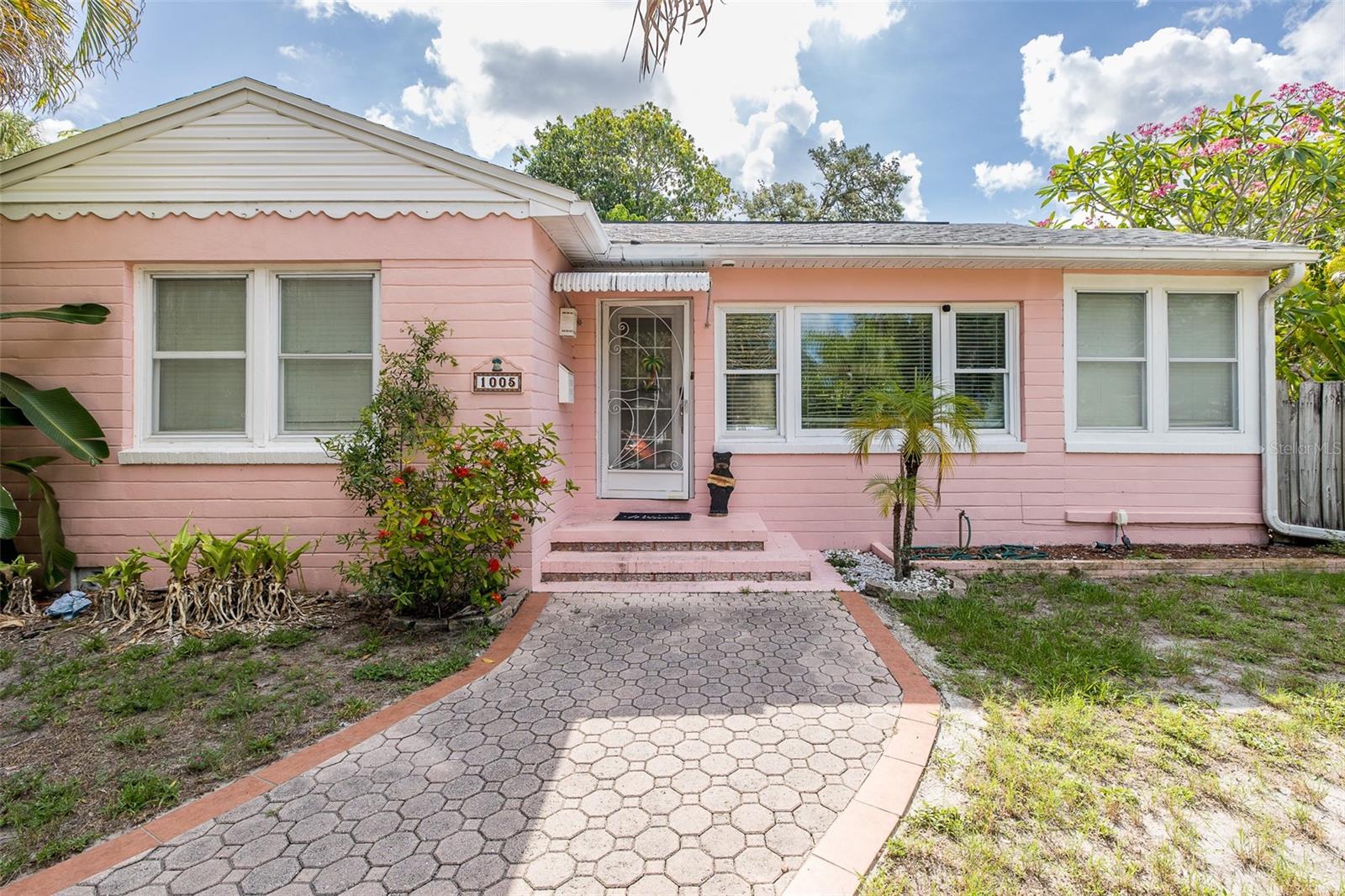 Under contract-accepting backup offers. Charming concrete block bungalow on a corner lot in the desirable Euclid-St. Paul’s neighborhood, offering character, flexibility, and classic St. Petersburg charm. This 2 bedroom, 1 bathroom home features beautiful oak hardwood floors, a tastefully updated bathroom, newer updated windows, and the added peace of mind of a 2020 roof and 2020 HVAC. The kitchenette is well appointed with stainless steel appliances, including a Bosch 5-burner gas range with convection oven, Bosch dishwasher, Fisher & Paykel French door refrigerator, and Samsung washer and dryer. A whole-home water softener and gas appliances add to the home’s functionality. Situated in Flood Zone X and a non-evacuation zone, this property offers everyday comfort with long-term potential. The spacious yard is filled with tropical fruit trees, including mango, banana, pineapple, avocado, and Mexican breadfruit, creating a private outdoor retreat complete with an outdoor shower, large storage shed, and newer PVC vinyl fencing across the back of the yard. Dual gated alley access adds convenience and flexibility for future use. The indoor and outdoor living spaces offer wonderful flexibility, and the possibilities are endless. Enjoy this charming bungalow as-is or explore options to expand and customize it to fit your needs. Perfectly positioned near the heart of downtown St. Pete and just a short walk to St. Anthony’s Hospital, this home offers easy access to the vibrant lifestyle that makes this area so special. Spend your weekends exploring Central Avenue’s restaurants, boutiques, galleries, murals, and nightlife, take in the waterfront along Beach Drive and the St. Pete Pier, enjoy events at Vinoy Park, or visit nearby cultural favorites like the Dalí Museum, Museum of Fine Arts, and The James Museum. Whether you love dining out, live entertainment, art, parks, local markets, or simply being close to the energy of downtown, this location puts it all within easy reach. What are you waiting for? Come experience the charm, lifestyle, and possibilities of this St. Pete bungalow for yourself!