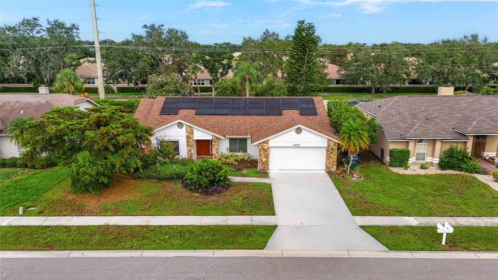 Virtually Staged. From the bright, open living spaces to the screened pool and fully fenced backyard, this beautifully maintained Emerald Gardens home is designed for comfortable everyday living and entertaining. Equipped with solar panels that help keep monthly electric costs low, this 3-bedroom, 2-bathroom home also features a dedicated den, formal dining room, and a desirable split bedroom floor plan. Vaulted ceilings and skylights fill the main living area with natural light, creating a bright and inviting atmosphere throughout the home. The kitchen features granite countertops, solid wood cabinetry, stainless steel appliances, a breakfast bar, and a sunny breakfast nook overlooking the pool. It's the perfect place to enjoy your morning coffee or casual meals while taking in the backyard views. The split bedroom floor plan provides added privacy for the primary suite, complete with a walk-in closet, en-suite bathroom, and the convenience of an in-suite laundry area. Two additional bedrooms are located on the opposite side of the home, each featuring their own walk-in closets and easy access to the guest bathroom. A separate den can easily serve as a home office, media room, playroom, fitness room, or hobby space. Sliding glass doors open to the screened lanai and pool, creating a natural extension of the home's living space. The fully fenced backyard is surrounded by mature landscaping, providing privacy and plenty of room to relax or entertain. Located in the desirable community of Emerald Gardens, residents enjoy low annual HOA fees, a neighborhood pond with a sitting dock, and a central Sarasota location just minutes from shopping, dining, Downtown Sarasota, and Siesta Key Beach. Don't miss your opportunity to make this Emerald Gardens home your own. Schedule your private tour today!