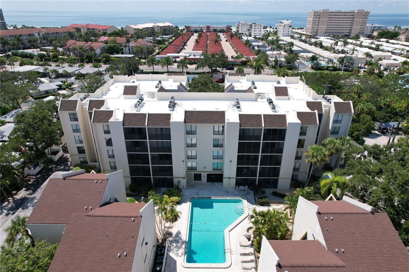 **Weekly rentals, prime Siesta Key location, and immediate income potential—this is the beach investment opportunity buyers wait for.** Welcome to Bay Oaks, where island living meets exceptional rental flexibility in one of the most desirable communities on Siesta Key.

This beautifully updated **2-bedroom, 2-bath condo** is being offered **fully turn-key furnished**, making ownership effortless from day one. Even better, **future rental bookings are already in place**, allowing you to start generating income immediately—**no waiting, no setup, no downtime**. Just close and collect.

Since its last listing, the home has been enhanced with a **newly renovated kitchen**, featuring stylish modern finishes that elevate both form and function. The bright, open-concept layout creates an inviting coastal feel, with seamless flow between the kitchen, dining, and living spaces—perfect for relaxing after a day at the beach or entertaining guests.

Enjoy peaceful mornings on your private balcony surrounded by lush tropical landscaping, while both spacious bedrooms provide comfortable retreats filled with natural light.

Bay Oaks is beloved for its unbeatable location and resort-style amenities. Situated on the bayside of Siesta Key and just moments from the powdery sands of world-famous **Siesta Key Beach**, residents and guests enjoy access to a sparkling pool, private fishing pier, tennis courts, shuffleboard, and beautifully maintained grounds. Hop on the free trolley for quick access to the restaurants, boutiques, and nightlife of **Siesta Key Village**.

For investors, the biggest advantage is Bay Oaks’ highly desirable **weekly rental policy**—a rare and valuable feature on Siesta Key that opens the door to strong vacation rental demand and attractive income potential.

Whether you're searching for a personal beach getaway, a savvy investment property, or the perfect combination of both, this Bay Oaks condo delivers. Flip-flops encouraged. **Updated Listing Photos Coming Soon!**